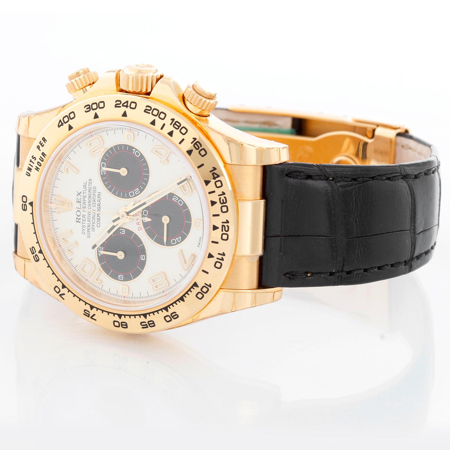 Rolex Cosmograph Daytona Men's 18k Yellow Gold Watch 116518 - Automatic winding, chronograph, 44 jewels, sapphire crystal. 18k yellow gold case and bezel with stickers . White dial with gold Arabic numerals known as the Panda Dial . Rolex leather