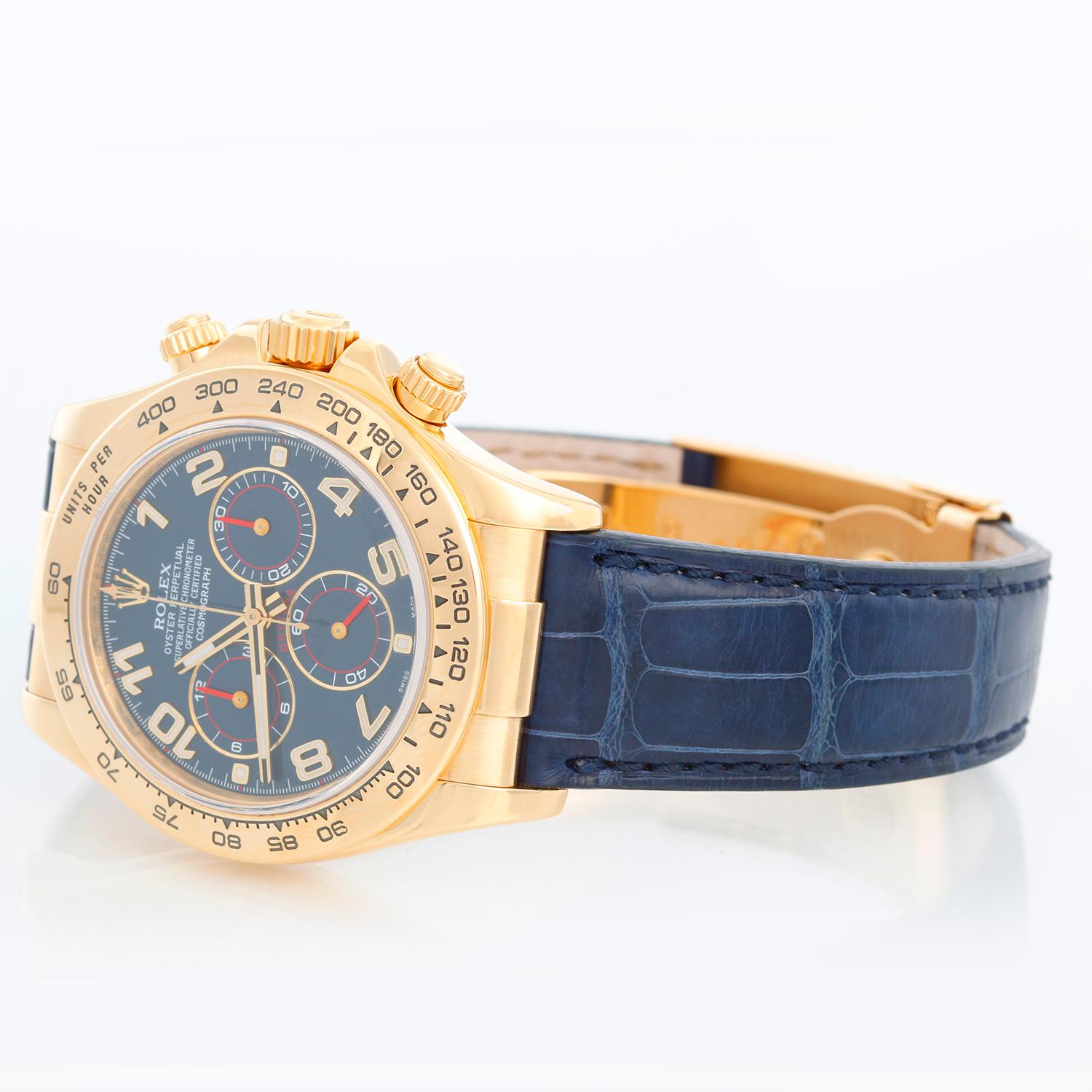 Rolex Cosmograph Daytona Men's 18k Yellow Gold Watch 116518 - Automatic winding, chronograph, 44 jewels, sapphire crystal. 18k yellow gold case and bezel with stickers. Blue racing dial. Blue Rolex leather strap with 18k yellow gold deployant clasp.