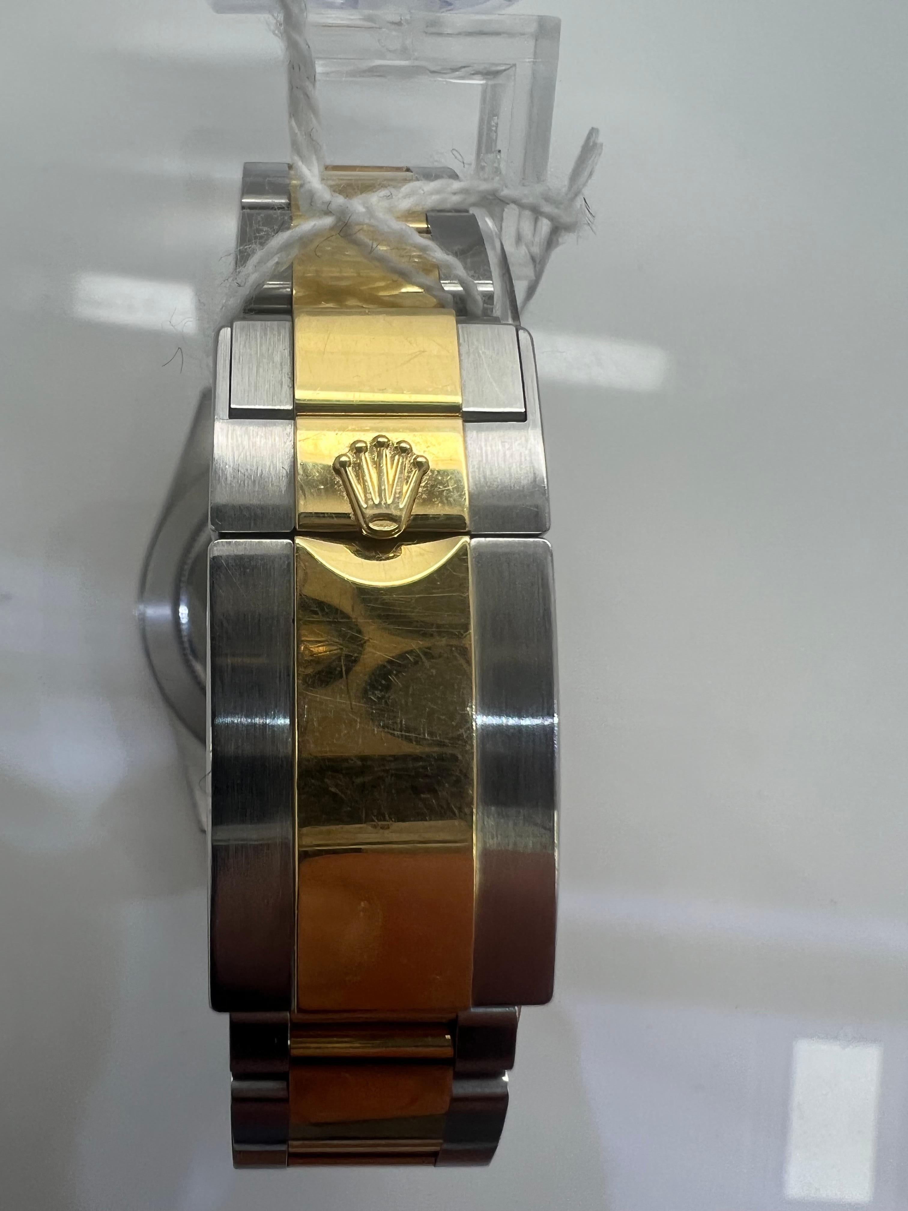rolex daytona gold price