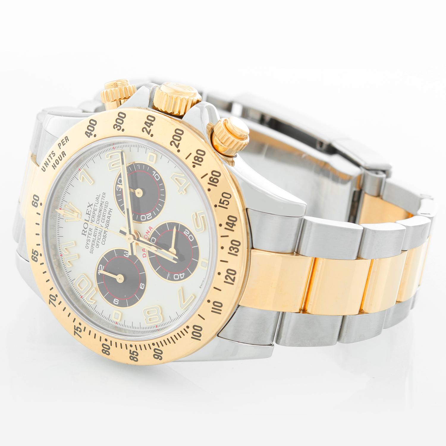 Rolex Cosmograph Daytona Men's Steel & Gold Watch 116523 Panda Dial  - Automatic winding, chronograph, 44 jewels, sapphire crystal. Stainless steel case with 18k yellow gold beel (40mm diameter). White dial with gold Arabic numerals and black