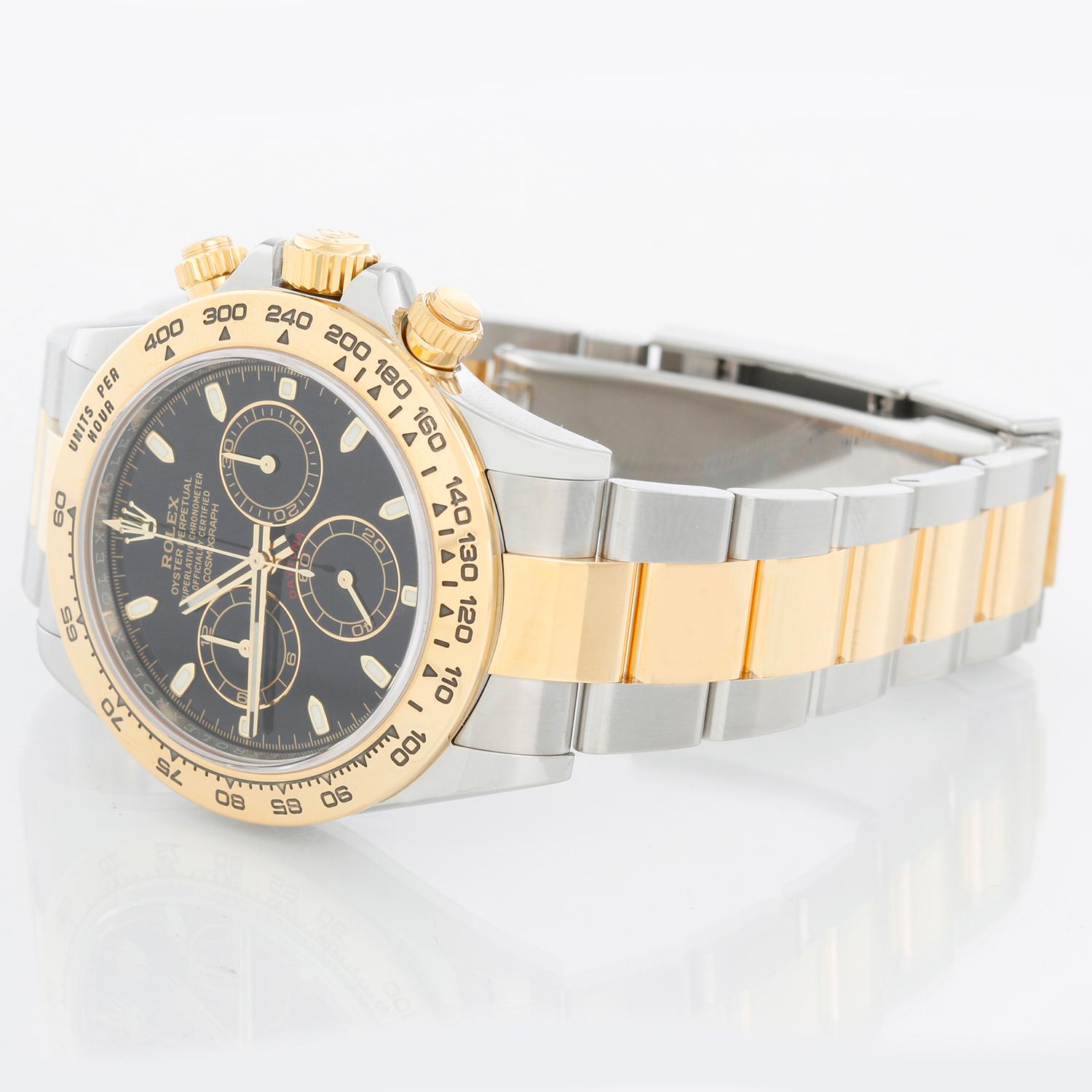 Rolex Cosmograph Daytona Men's Watch 116503 - Automatic winding, chronograph, 44 jewels, sapphire crystal. Stainless steel case with 18k yellow gold bezel ( 40 mm ) . Black dial with stick hour markers. Stainless steel and 18k yellow gold Oyster