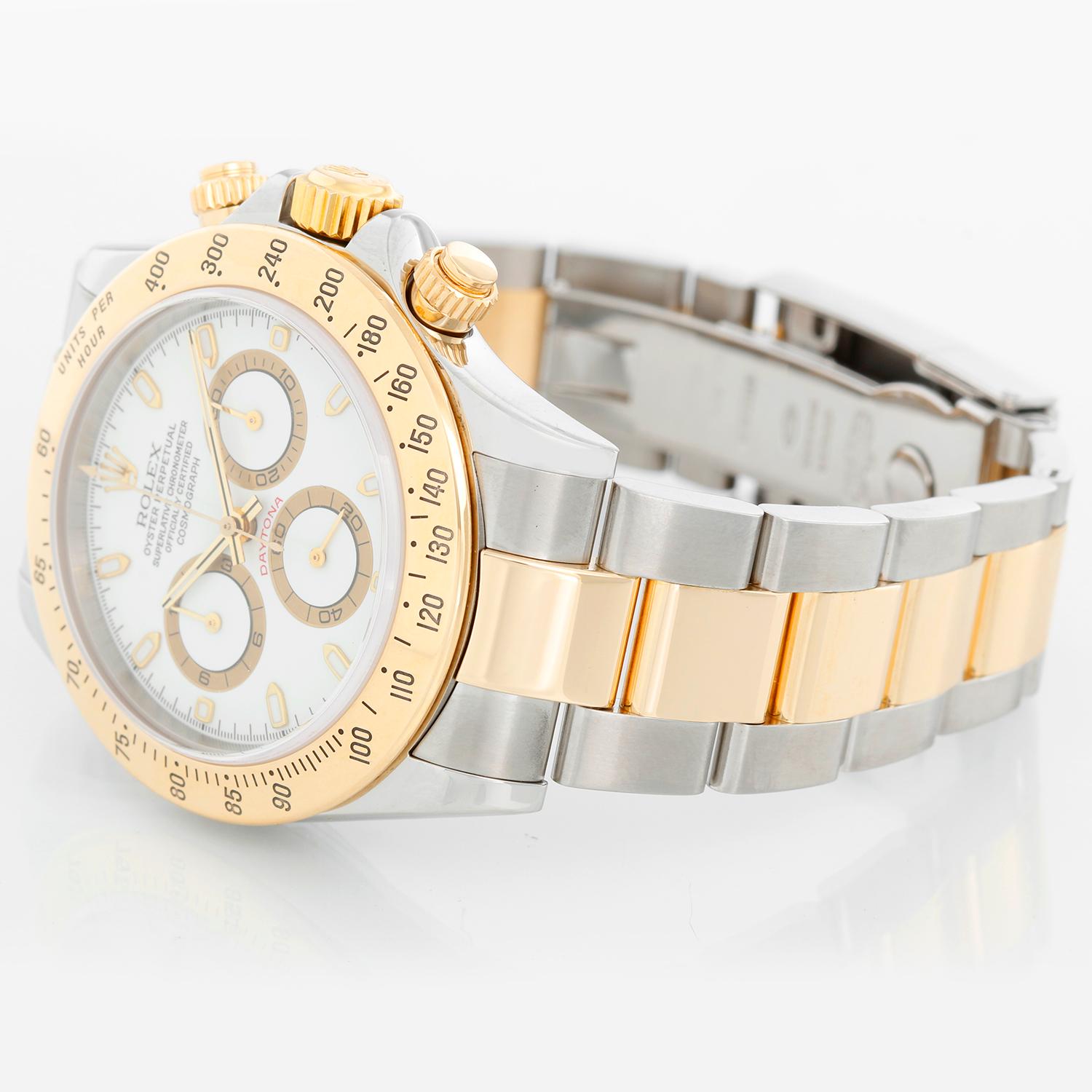 Rolex Cosmograph Daytona Men's Watch 116523 - Automatic winding, chronograph, 44 jewels, sapphire crystal. Stainless steel case with 18k yellow gold bezel. White dial with luminous-style markers. Stainless steel and 18k yellow gold Oyster bracelet
