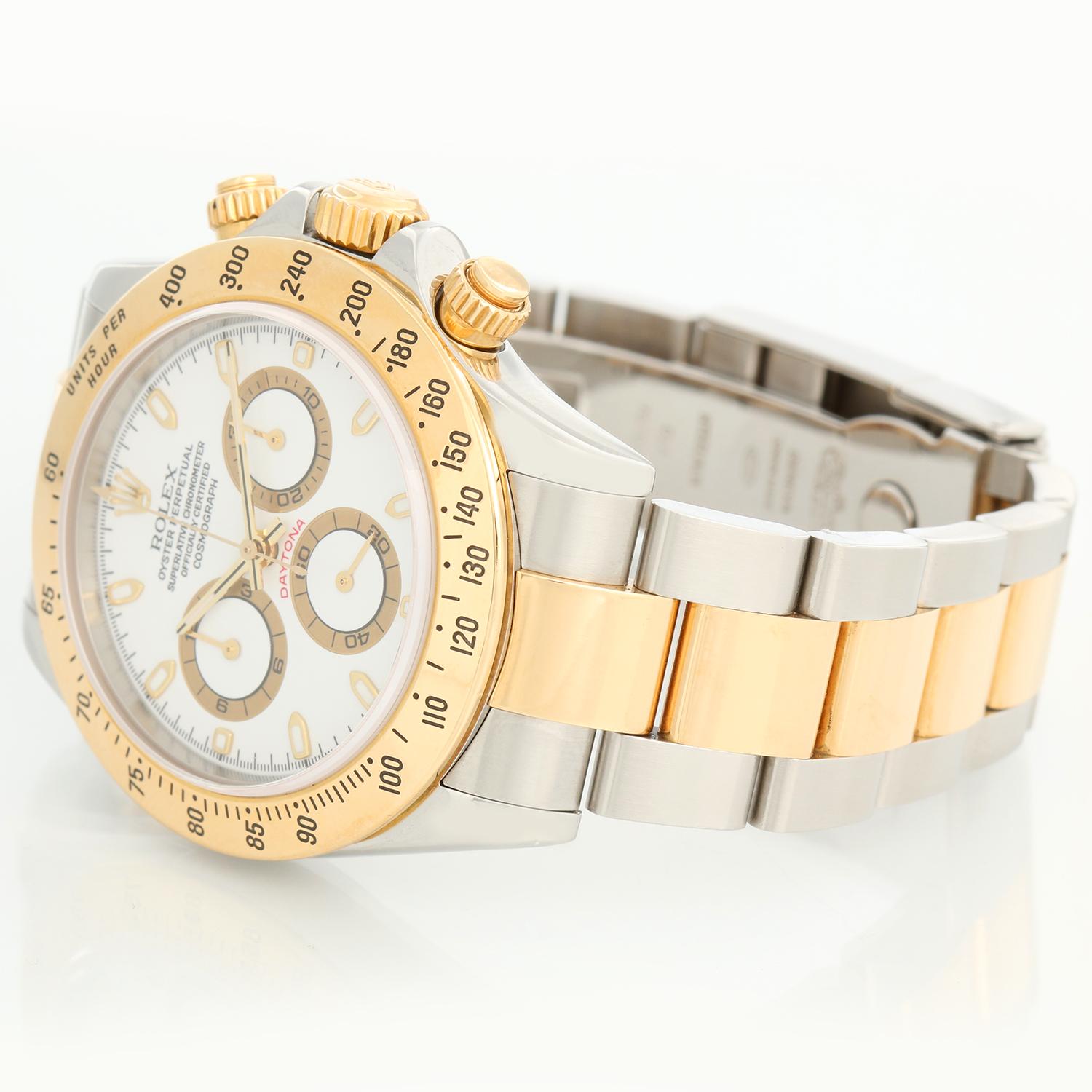 Rolex Cosmograph Daytona Men's Watch 116523 - Automatic winding, chronograph, 44 jewels, sapphire crystal. Stainless steel case with 18k yellow gold bezel. White dial with luminous-style markers. Stainless steel and 18k yellow gold Oyster bracelet