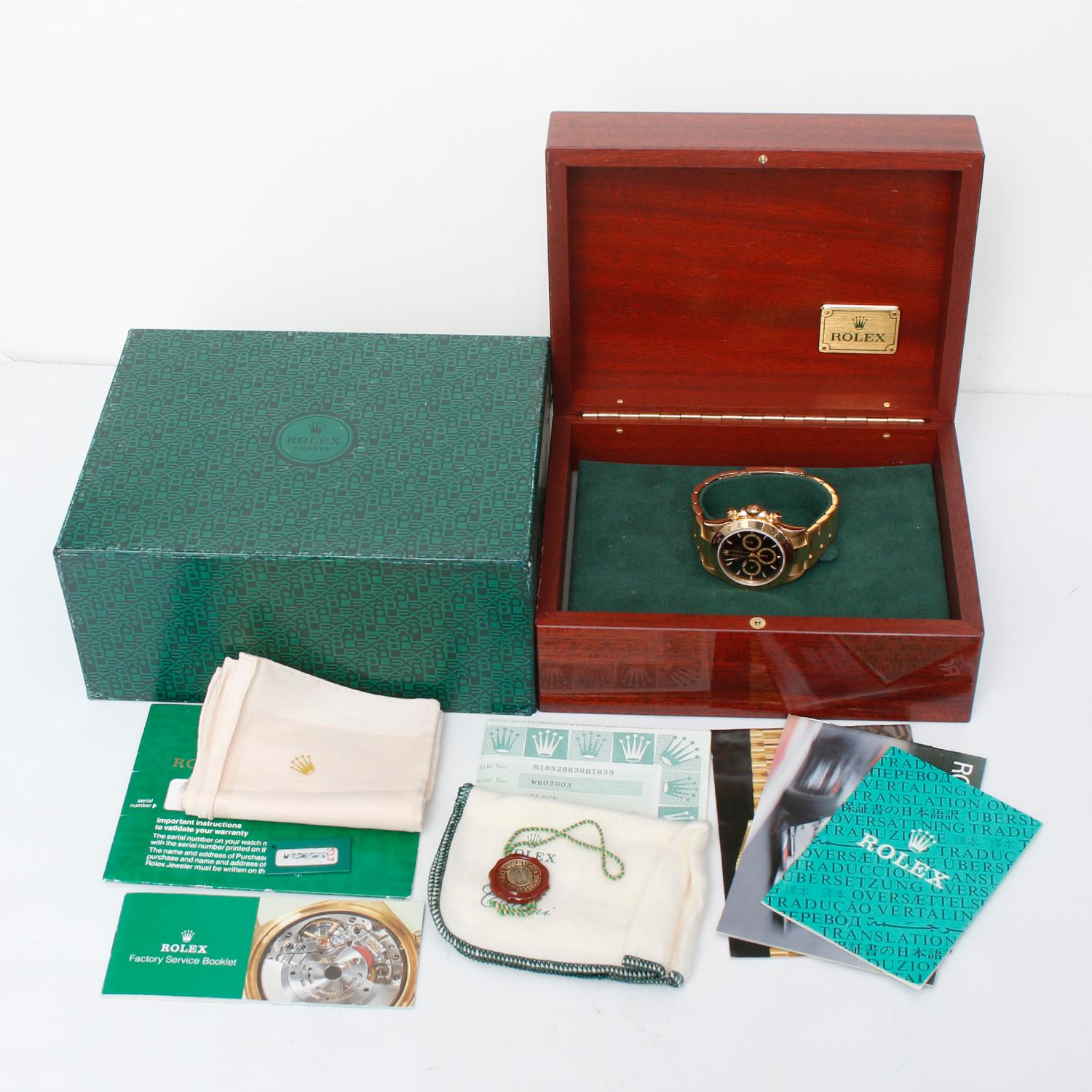 Rolex Cosmograph Zenith Daytona Men's 18k Yellow Gold Watch 16528 - Automatic winding, chronograph, 31 jewels, sapphire crystal. 18k yellow gold case and bezel  (40mm diameter). Black dial with gold markers and gold rimmed subdials. 18k yellow gold