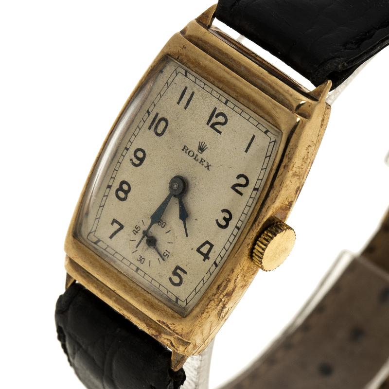 Your dream to own a beautiful vintage creation comes true in this timepiece from none other than Rolex! The watch has been beautifully made from 9k yellow gold and held by textured leather straps. It has a rectangular case with a thin, smooth bezel,