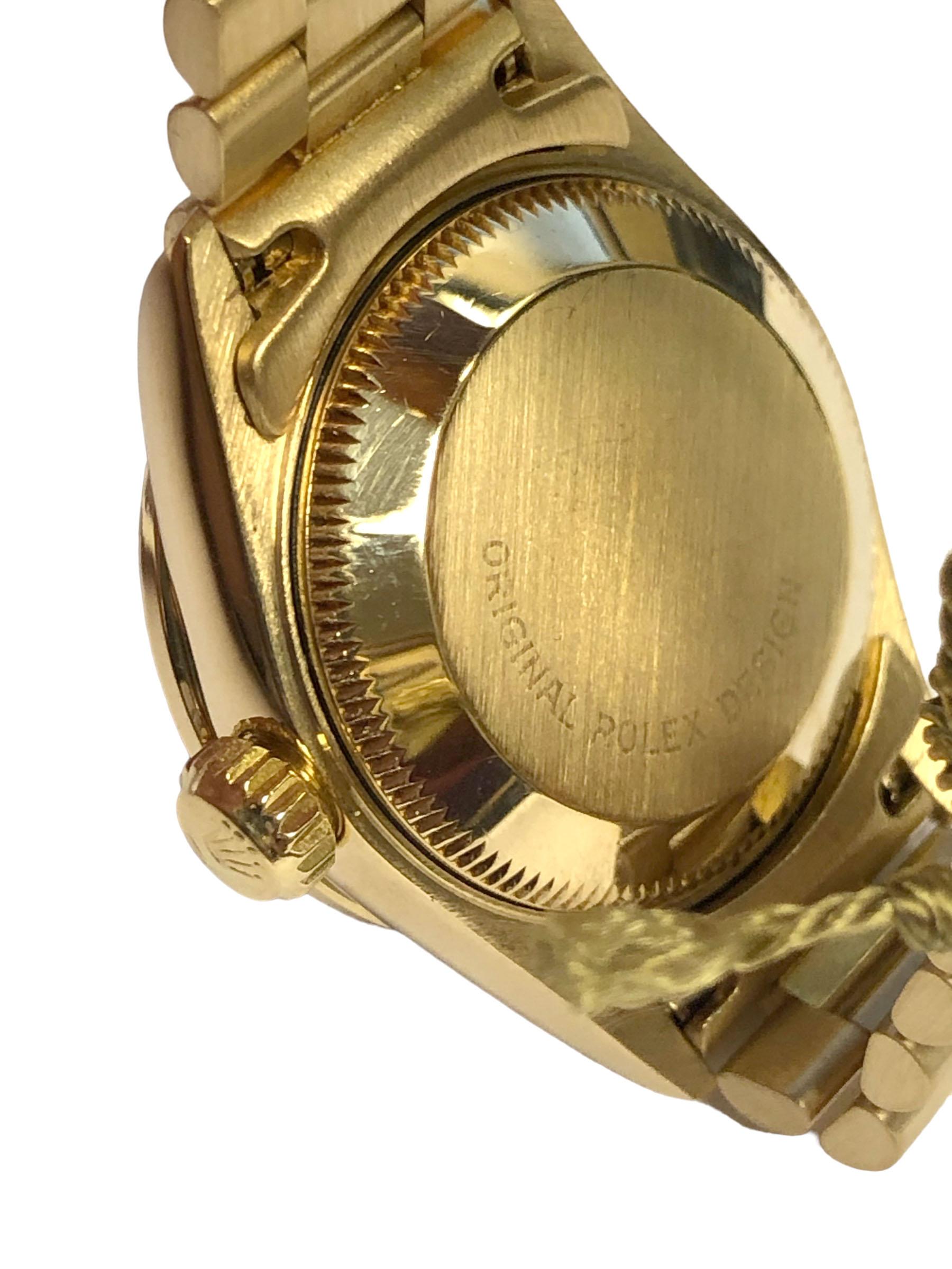 1988 Rolex Crown Collection, Presidential model Ladies Wrist Watch, 26 M.M. 18k Yellow Gold 3 piece water resistant Oyster case. Factory original Diamond bezel totaling approximately 1 Carat and further having Diamond set Lugs 29 Jewel Caliber 2135