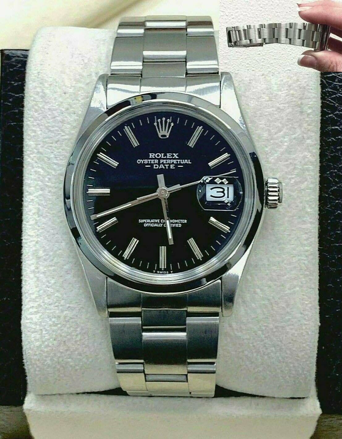 Style Number: 15000 

 

Serial: 7071***

 

Model: Date

 

Case Material: Stainless Steel

 

Band: Stainless Steel

 

Bezel:  Stainless Steel

 

Dial: Black

 

Face: Acrylic 

 

Case Size: 34mm

 

Includes: 

-Elegant Watch Box

-Certified
