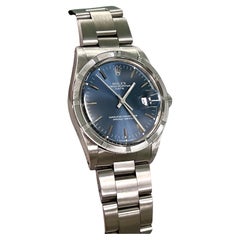 Rolex Date 15010 34mm Blue Dial Stainless Steel Engine-Turned Bezel Box Paper