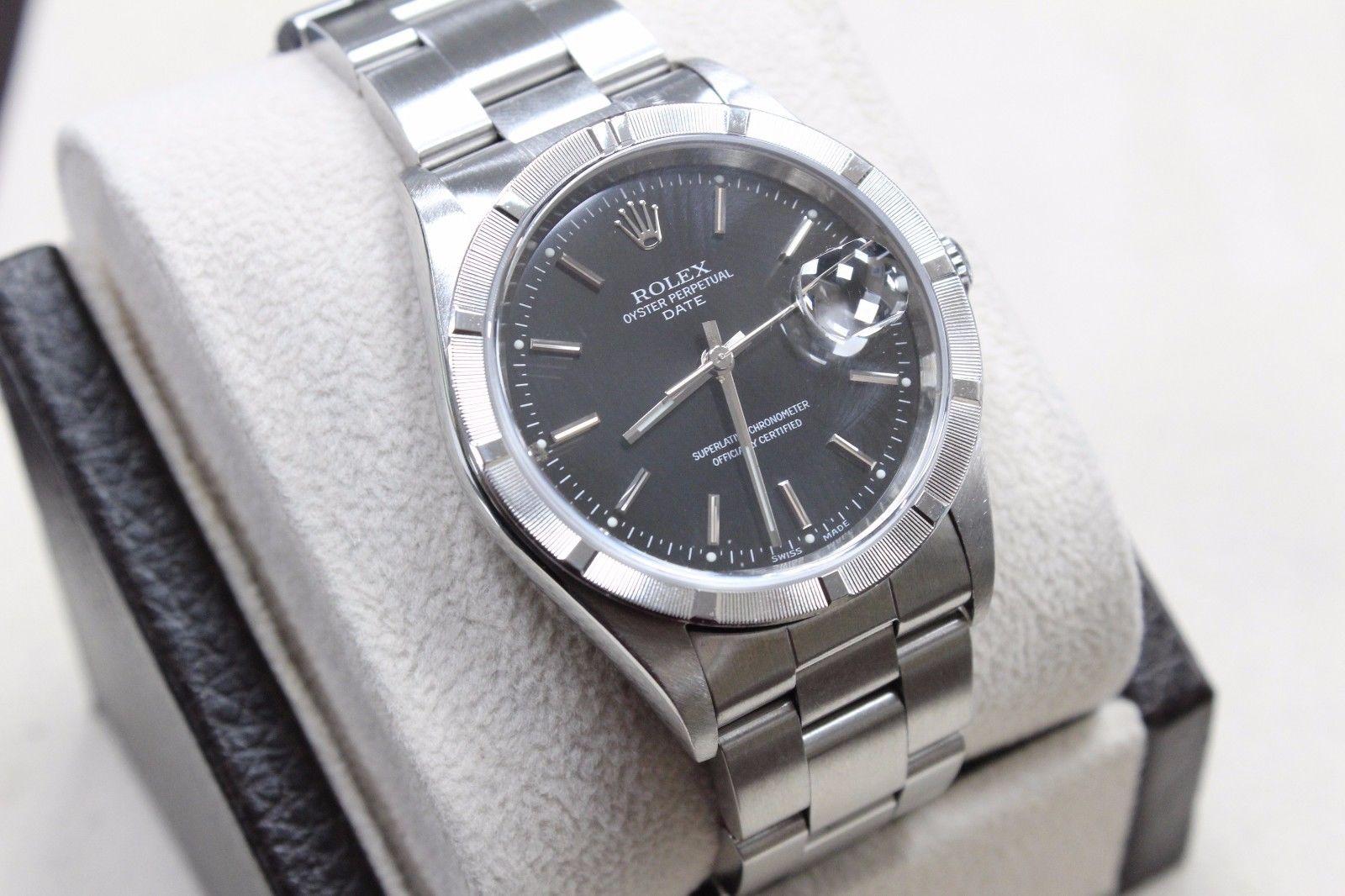 Style Number: 15210 

Serial: A888***

Model: Date

Case Material: Stainless Steel 

Band: Stainless Steel

Bezel: Stainless Steel 

Dial: Black

Face: Sapphire Crystal 

Case Size: 34mm

Includes: 

-Rolex Box & Papers

-Certified Appraisal 

-6