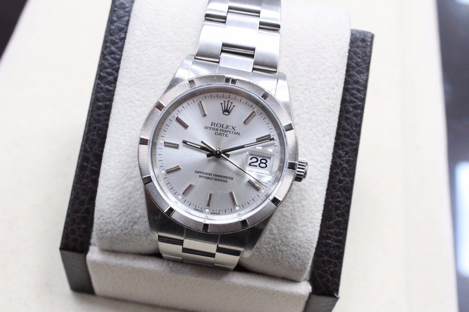 Style Number: 15210

Serial: F203***

Year: 2003

Model: Date

Case: Stainless Steel 

Band: Stainless Steel 

Bezel: Stainless Steel 

Dial: Silver

Face: Sapphire Crystal

Case Size: 34mm

Includes: 

-Elegant Watch Box

-Certified Appraisal 

-6