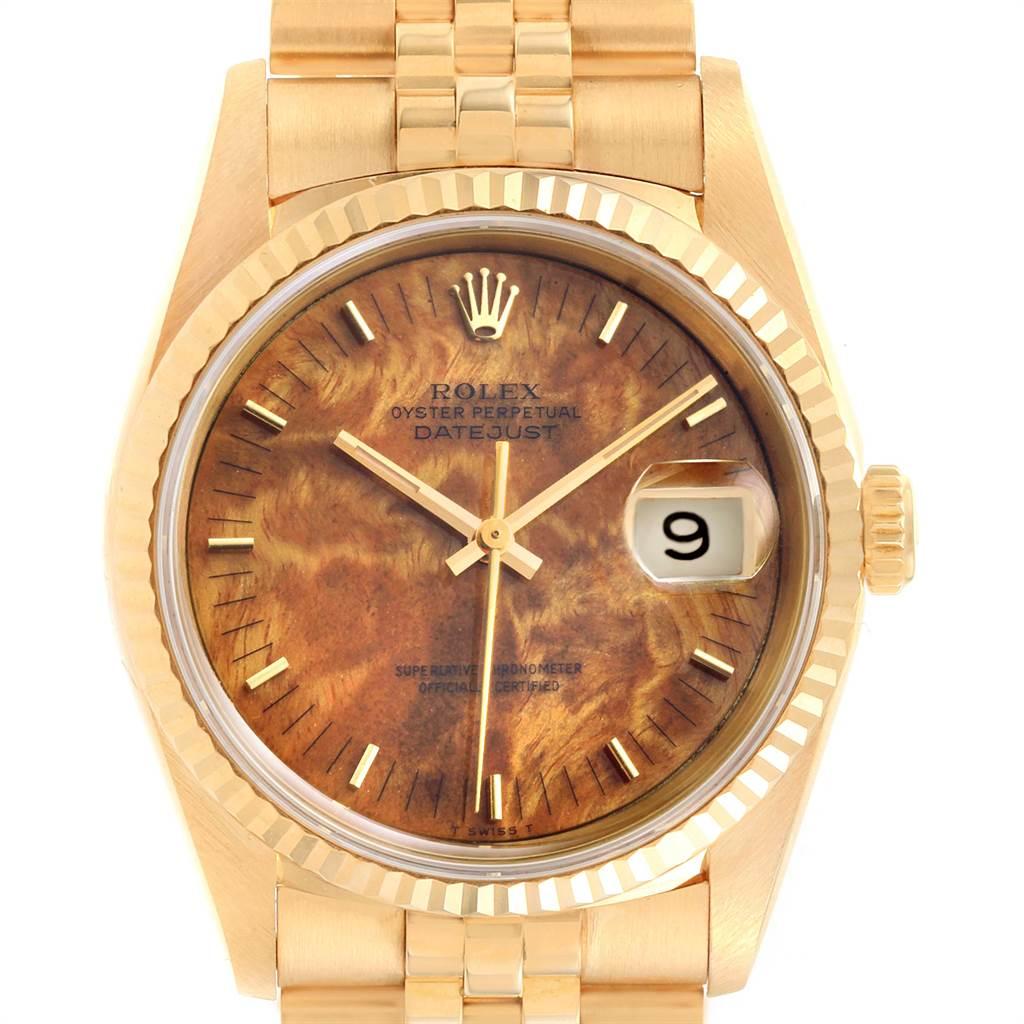 Rolex Date 18k Yellow Gold Burl Wood Dial Mens Watch 16238 Box Papers. Officially certified chronometer self-winding movement. 18k yellow gold case 34.0 mm in diameter. Rolex logo on a crown. 18k yellow gold fluted bezel. Scratch resistant sapphire