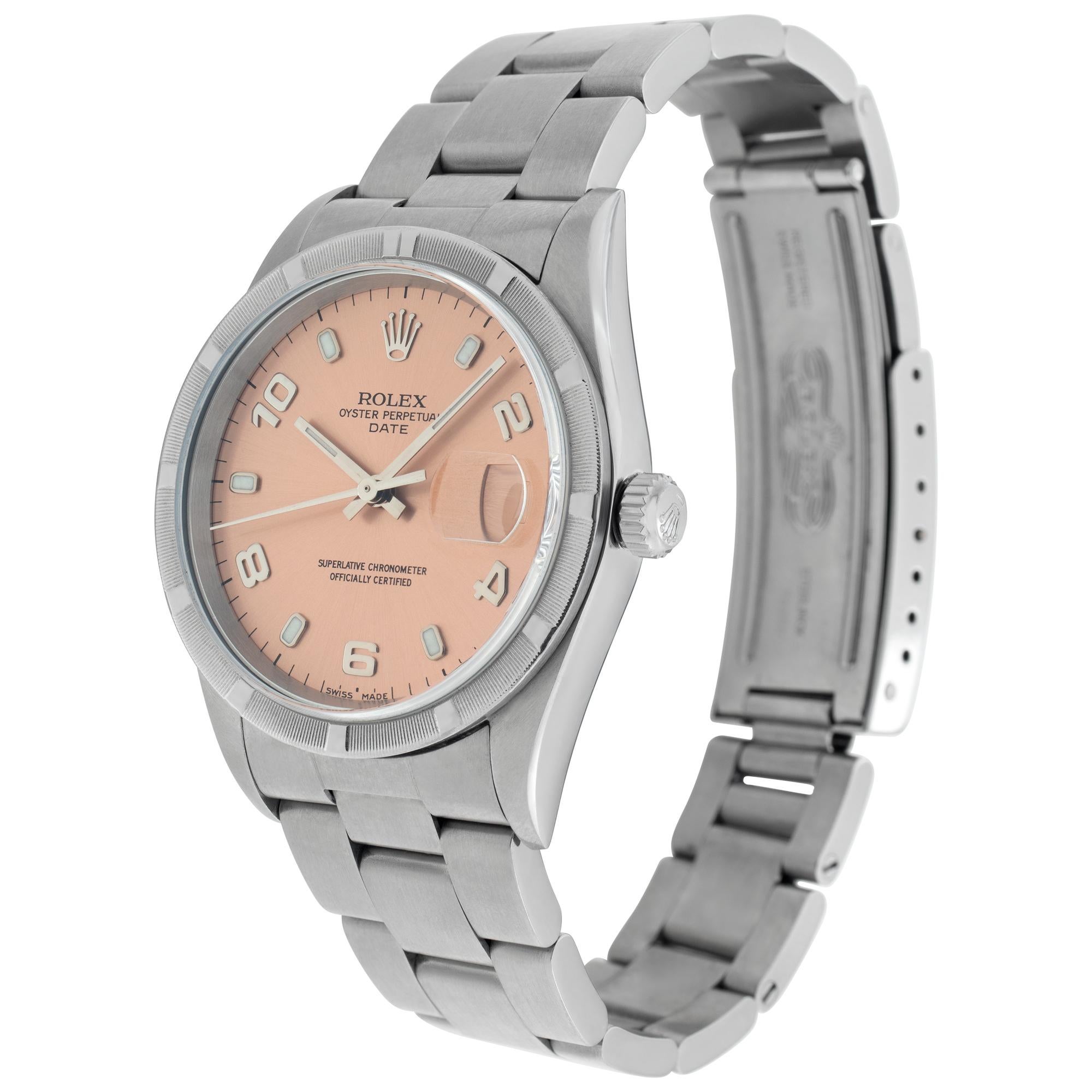 Rolex Date in stainless steel with Engine-Turned bezel & pink/salmon Arabic applied hour marker dial. Auto w/ sweep seconds and date. 34 mm case size. **Bank wire only at this price** Ref 15210. Circa 2000. Fine Pre-owned Rolex Watch. Certified