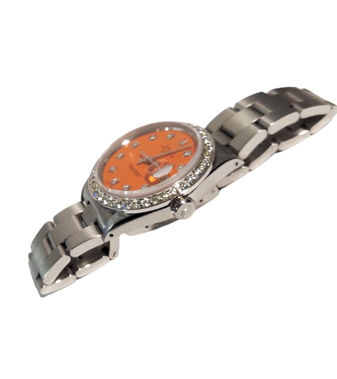 (Description)
Brand - Rolex
Model - 1500 
Style - Date
Metals - Stainless steel
Dial - Custom Matte Orange Diamond 
Bezel - Custom 1.0CT Diamond 
Crystal - sapphire 
Movement - Rolex auto CAL-1570 
Band - Stainless Steel Oyster

3 years In-House