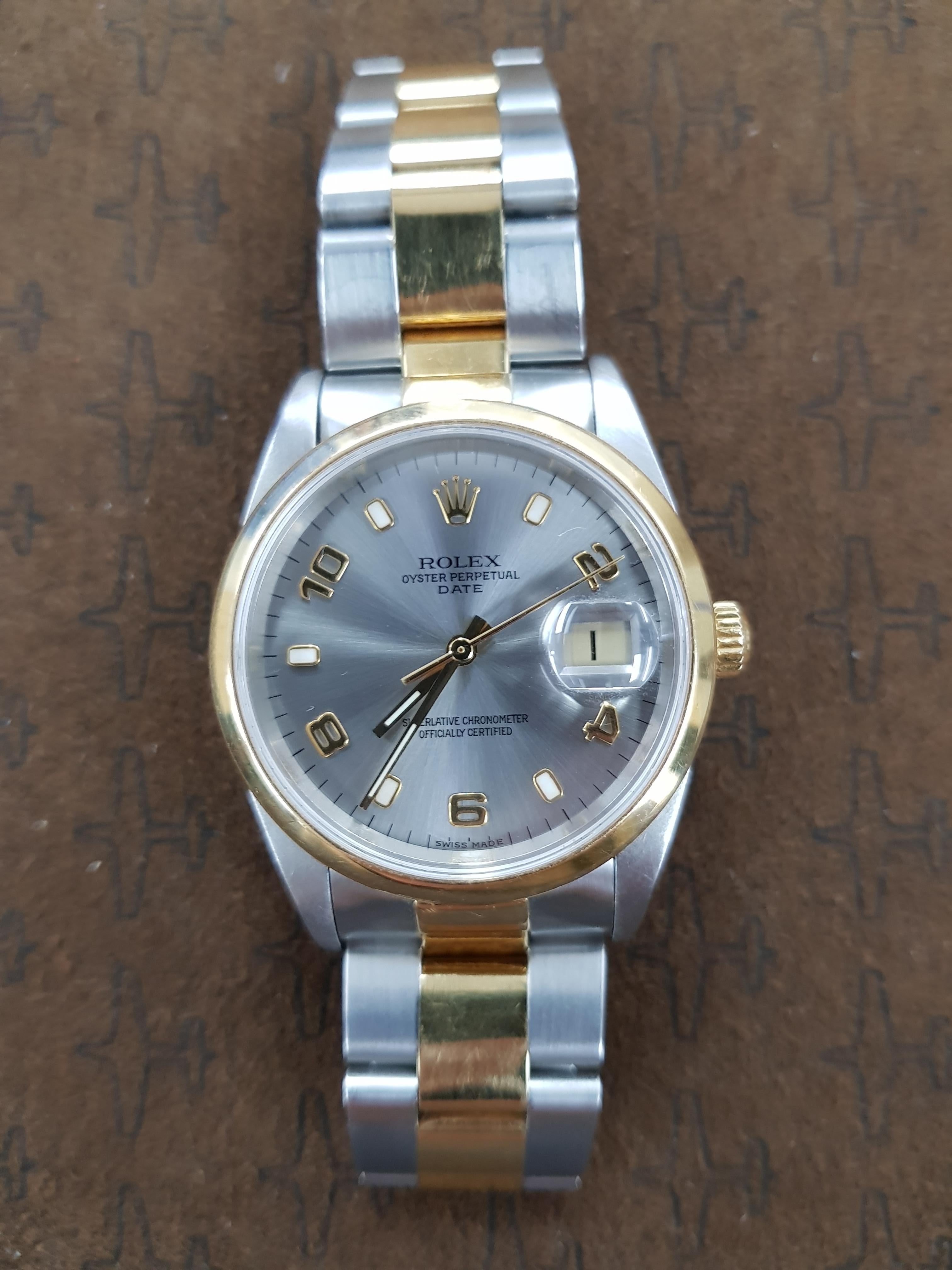 Bi-metal Rolex Date in gold and stainless steel with a 34 mm dial. This watch comes with full Rolex certification.