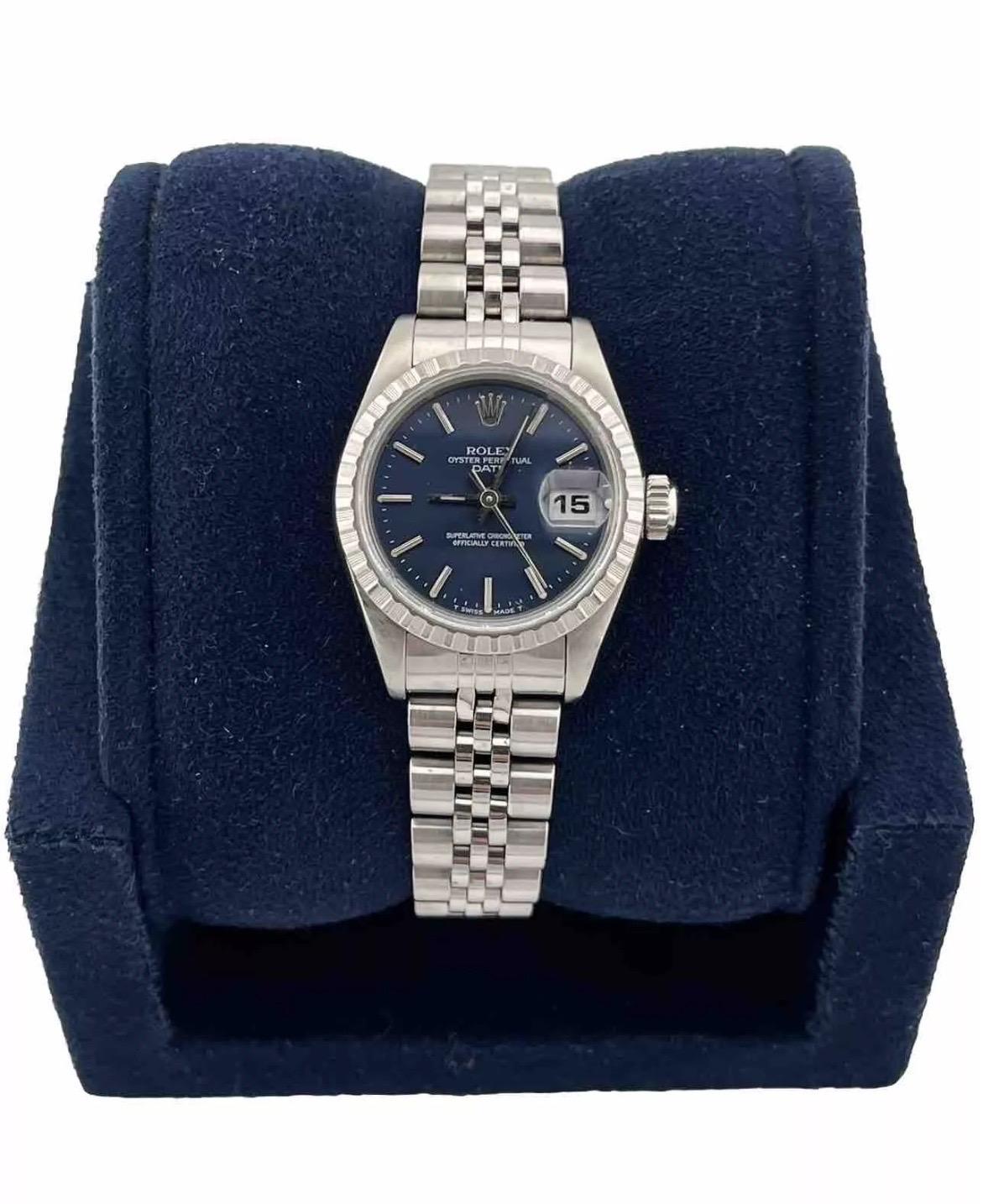 The Rolex Date Ladies Stainless Steel Watch Quickset Jubilee Band Blue Dial 69240 is a stunning timepiece that effortlessly combines elegance with practicality. Crafted from durable stainless steel, this 26mm watch features a vibrant blue dial that