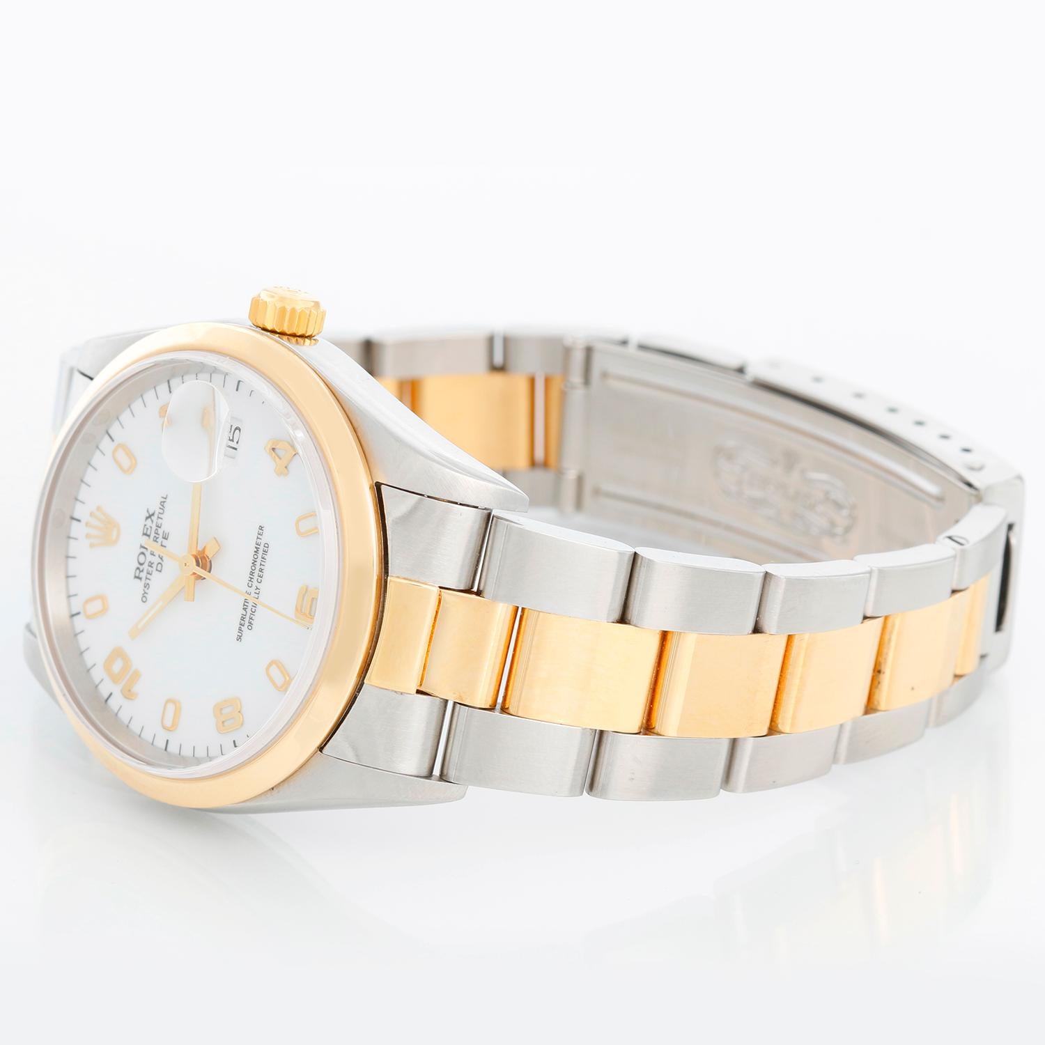 Rolex Date Men's 2-Tone Steel & Gold Watch 15203 - Automatic winding, 31 jewels, Quickset, sapphire crystal. Stainless steel case with 18k yellow gold smooth bezel (34mm diameter) Original Rolex finish. White dial with gold Arabic numerals .