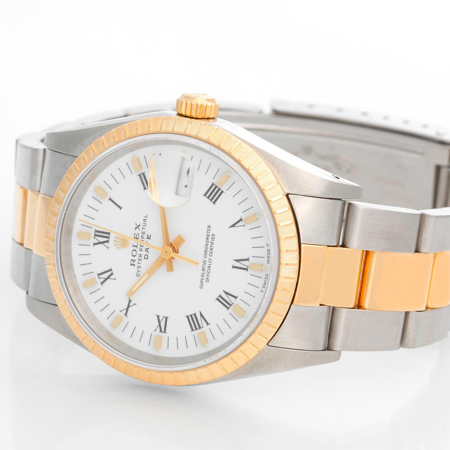 Rolex Date Men's 2-Tone Steel & Gold Watch 15223 - Automatic winding, 31 jewels, Quickset, sapphire crystal. Stainless steel case with 18k yellow gold fluted  bezel (34mm diameter). White dial with black Roman numerals. Stainless steel and 18k