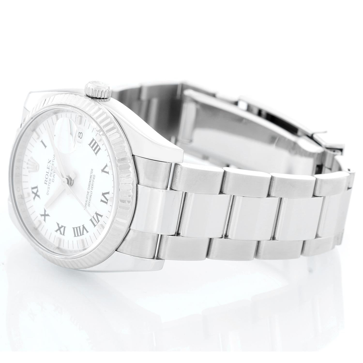 Rolex Date Men's Stainless Steel Watch 115234 - Automatic winding, 31 jewels, Quickset, sapphire crystal. Stainless steel case with 18k white gold fluted bezel ( 34 mm). White dial with roman numerals . Stainless steel Oyster bracelet. Pre-owned