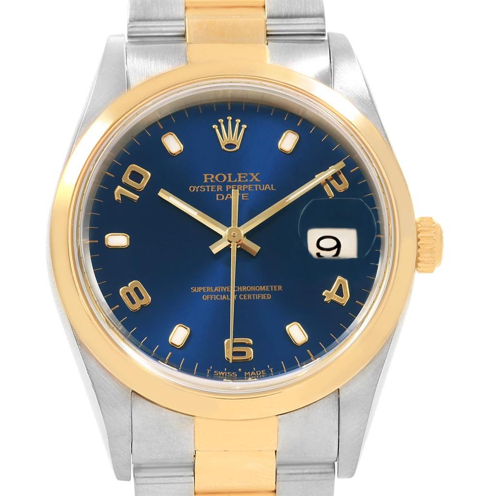 Rolex Date Mens Steel 18K Yellow Gold Blue Dial Mens Watch 15203. Officially certified chronometer self-winding movement with quickset date function. Stainless steel and 18K yellow gold oyster case 34.0 mm in diameter. Rolex logo on a crown. Scratch