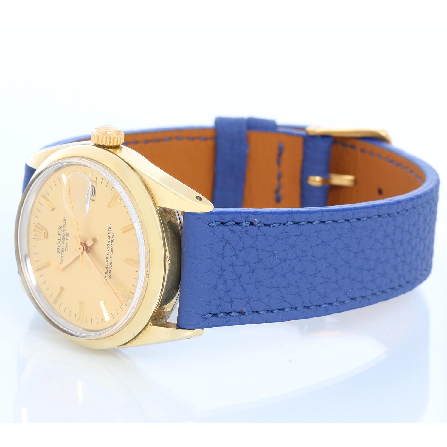 Rolex Date Men's Vintage 14k Gold Shell Watch 1550 - Automatic winding, acrylic crystal. 14k yellow gold shell case with smooth bezel (34mm diameter). Champagne dial with stick hour markers . Blue strap bracelet with tang buckle . Pre-owned with