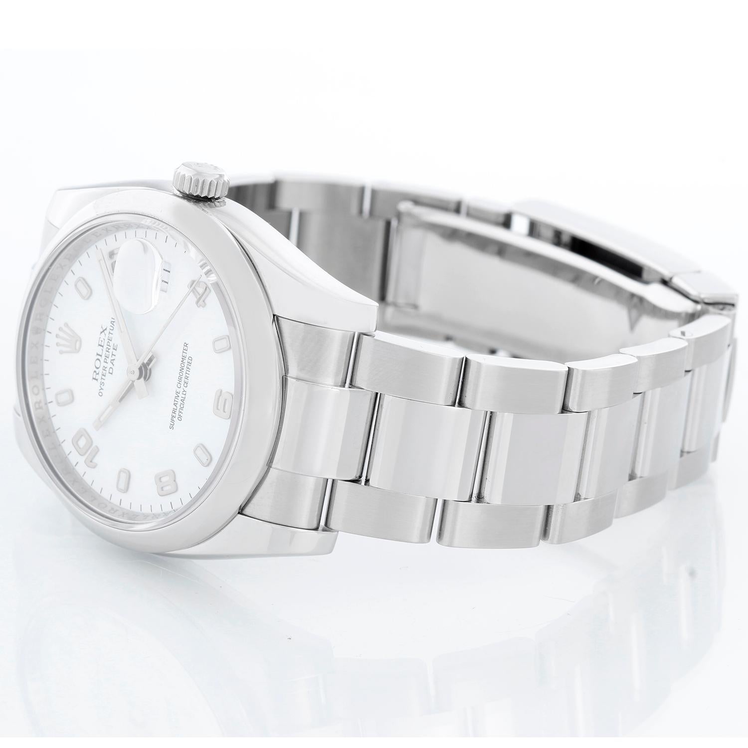 Rolex Date Oyster Perpetual Men's Watch 115200 - 115200. Stainless Steel ( 34 mm ) Smooth bezel. White dial with luminous hour markers. Oyster bracelet with deployant buckle. Pre-owned with Rolex box and book
