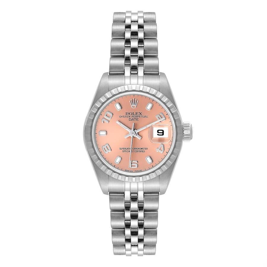 Rolex Date Salmon Dial Engine Turned Bezel Steel Ladies Watch 79240 Box Papers. Officially certified chronometer automatic self-winding movement. Stainless steel oyster case 26 mm in diameter. Rolex logo on the crown. Stainless steel engine turned