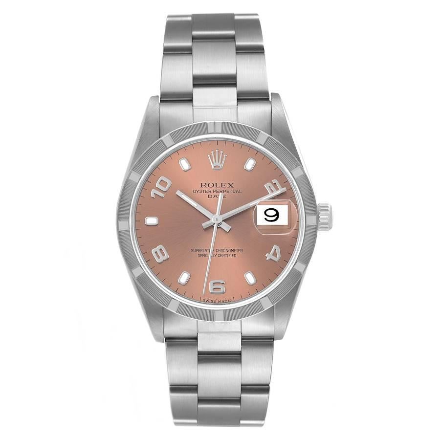 Rolex Date Salmon Dial Engine Turned Bezel Steel Mens Watch 15210 Box Papers. Officially certified chronometer automatic self-winding movement with quickset date function. Stainless steel oyster case 34.0 mm in diameter. Rolex logo on the crown.