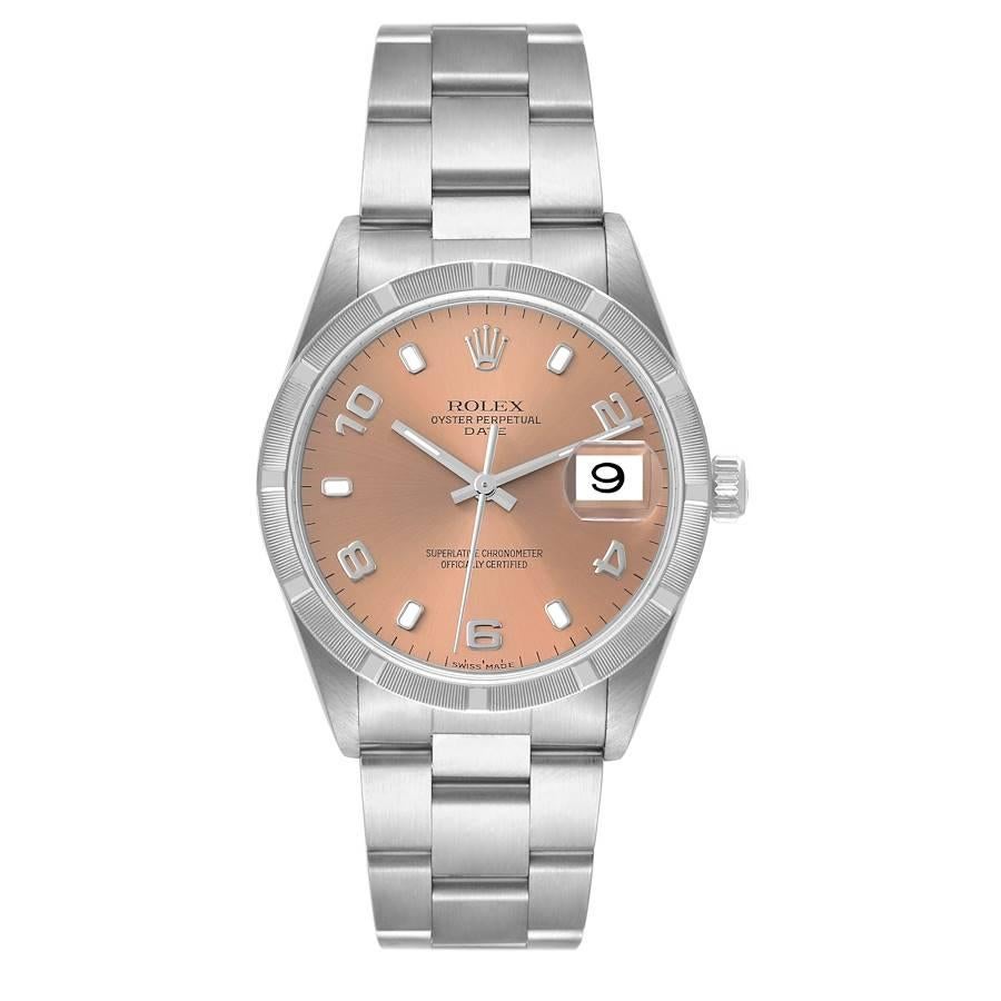 Rolex Date Salmon Dial Engine Turned Bezel Steel Mens Watch 15210. Officially certified chronometer automatic self-winding movement with quickset date function. Stainless steel oyster case 34.0 mm in diameter. Rolex logo on the crown. Stainless