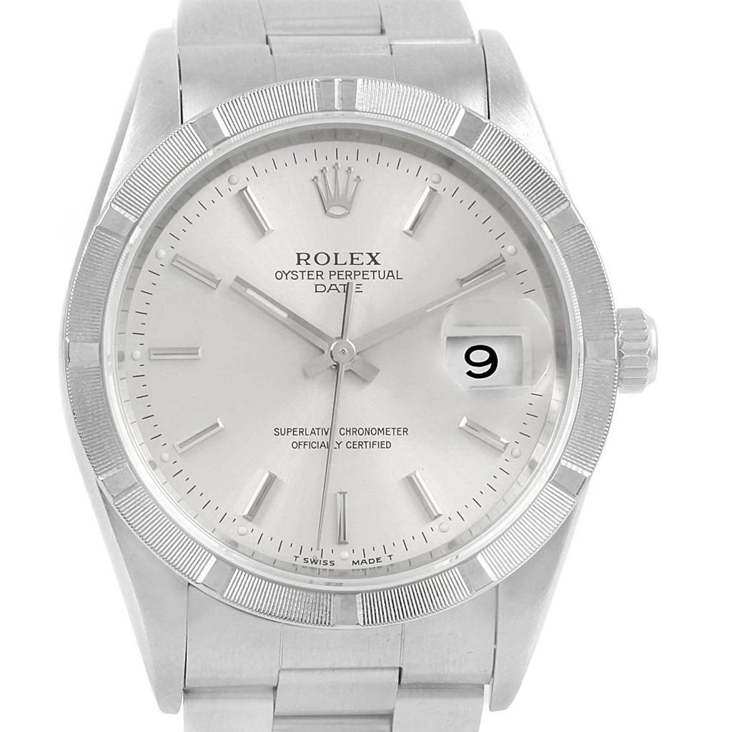 Rolex Date Silver Dial Engine Turned Bezel Steel Mens Watch 15210. Officially certified chronometer self-winding movement with quickset date function. Stainless steel oyster case 34.0 mm in diameter. Rolex logo on a crown. Stainless steel engine