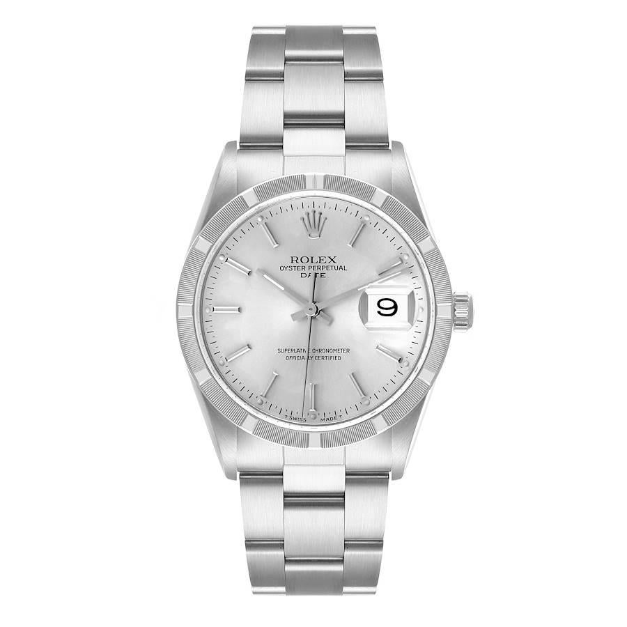 Rolex Date Silver Dial Steel Engine Turned Bezel Mens Watch 15210. Officially certified chronometer self-winding movement with quickset date. Stainless steel case 34.0 mm in diameter. Rolex logo on the crown. Stainless steel engine turned bezel.