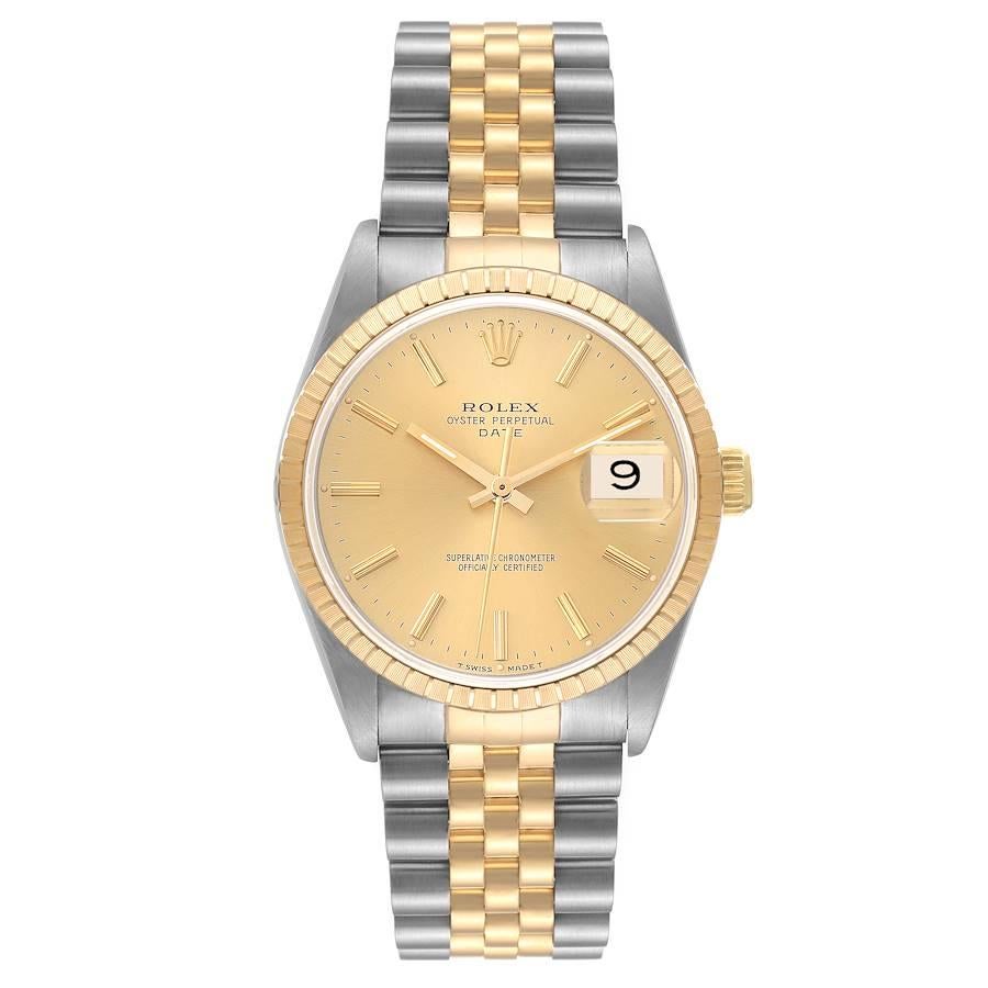 Rolex Date Steel Yellow Gold Engine Turned Bezel Champagne Dial Mens Watch 15223. Officially certified chronometer automatic self-winding movement. Stainless steel and 18K yellow gold oyster case 34.0 mm in diameter. Rolex logo on the crown. 18K