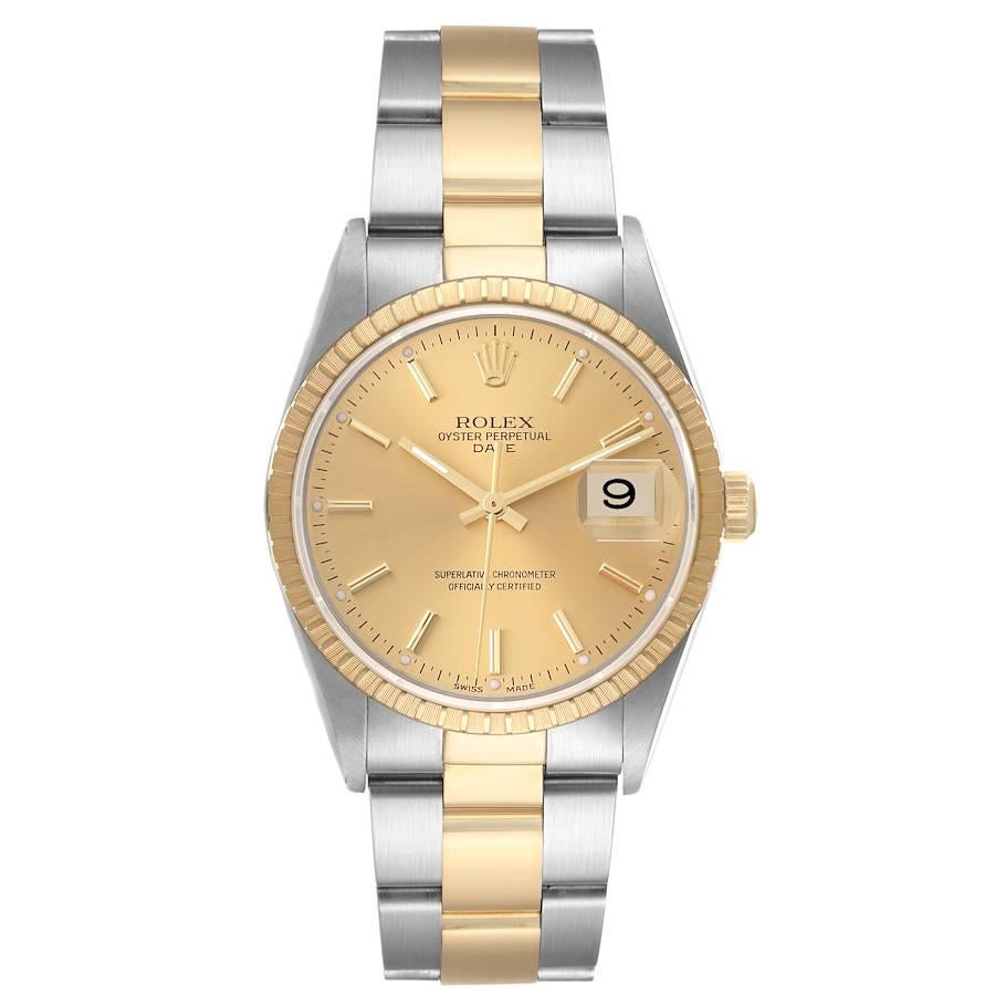 Rolex Date Steel Yellow Gold Engine Turned Bezel Champagne Dial Mens Watch 15223. Officially certified chronometer automatic self-winding movement. Stainless steel and 18K yellow gold oyster case 34.0 mm in diameter. Rolex logo on the crown. 18K