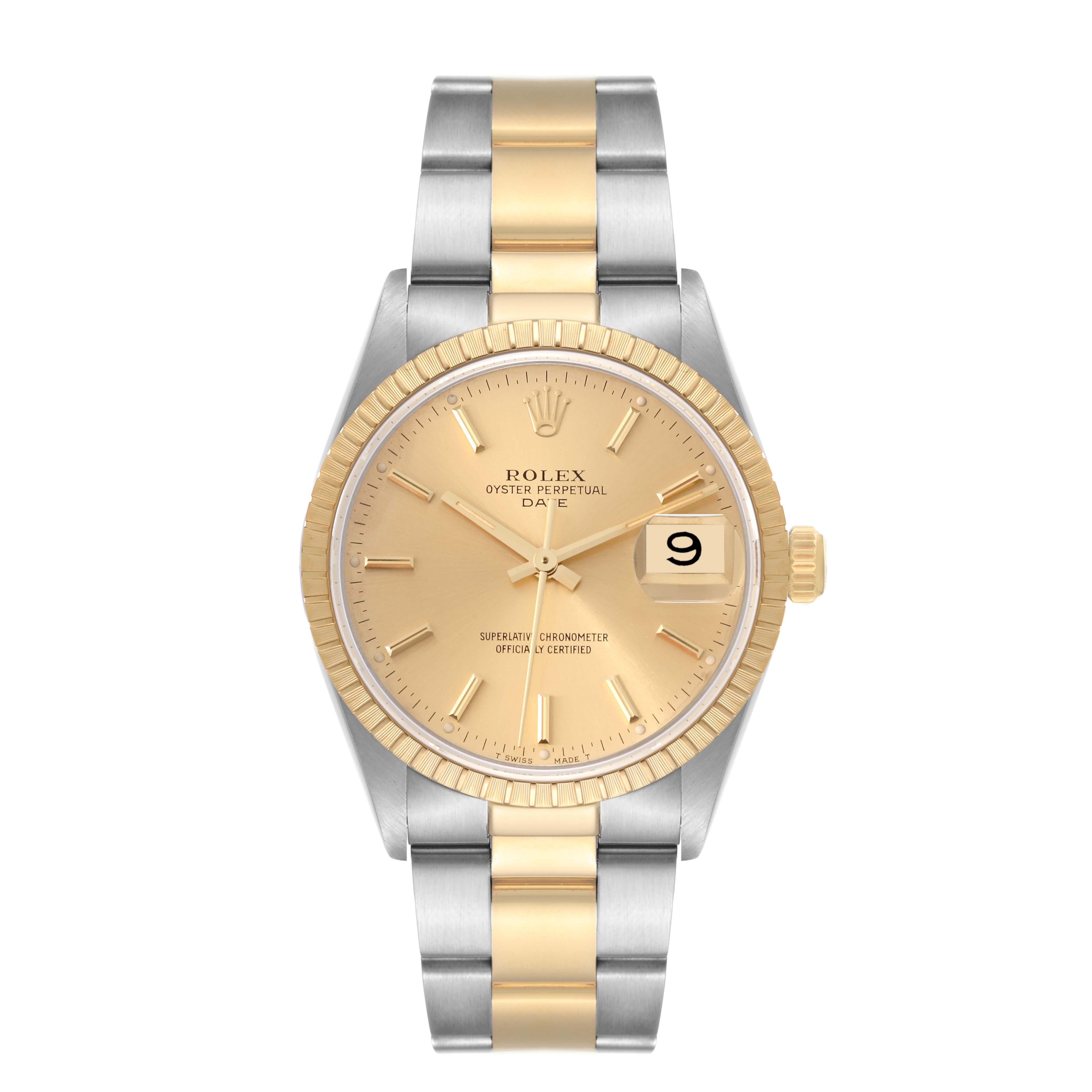 Rolex Date Steel Yellow Gold Engine Turned Bezel Champagne Dial Mens Watch 15223. Officially certified chronometer automatic self-winding movement. Stainless steel and 18K yellow gold oyster case 34.0 mm in diameter. Rolex logo on the crown. 18K