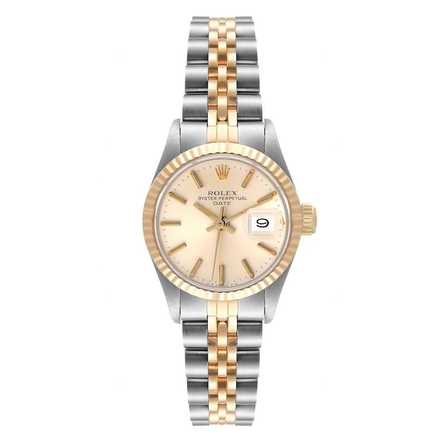 Rolex Date Steel Yellow Gold Silver Dial Fluted Bezel Ladies Watch 6917. Officially certified chronometer self-winding movement. Stainless steel and 14K yellow gold oyster case 26.0 mm in diameter. Rolex logo on a crown. 14k yellow gold fluted