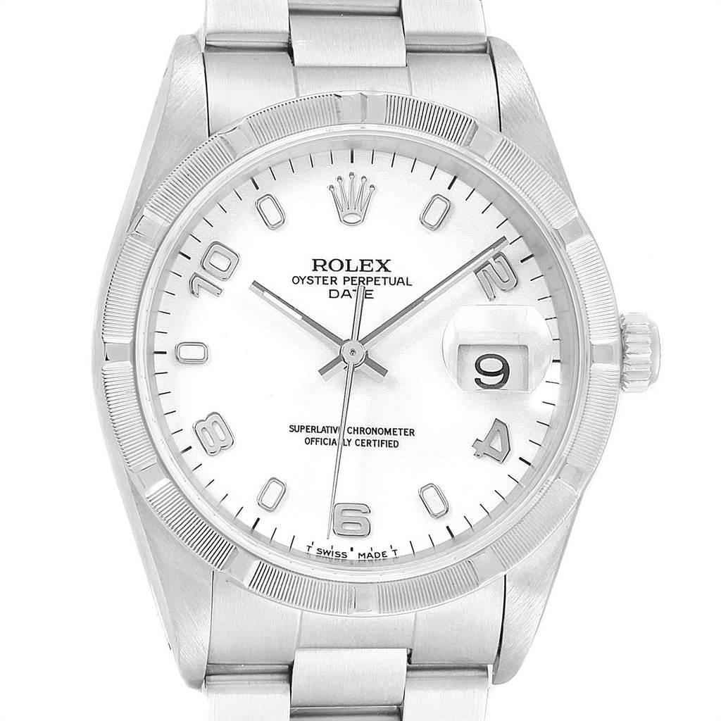 Rolex Date White Dial Engine Turned Bezel Steel Mens Watch 15210. Officially certified chronometer automatic self-winding movement. Stainless steel oyster case 34.0 mm in diameter. Rolex logo on a crown. Stainless steel engine turned bezel. Scratch
