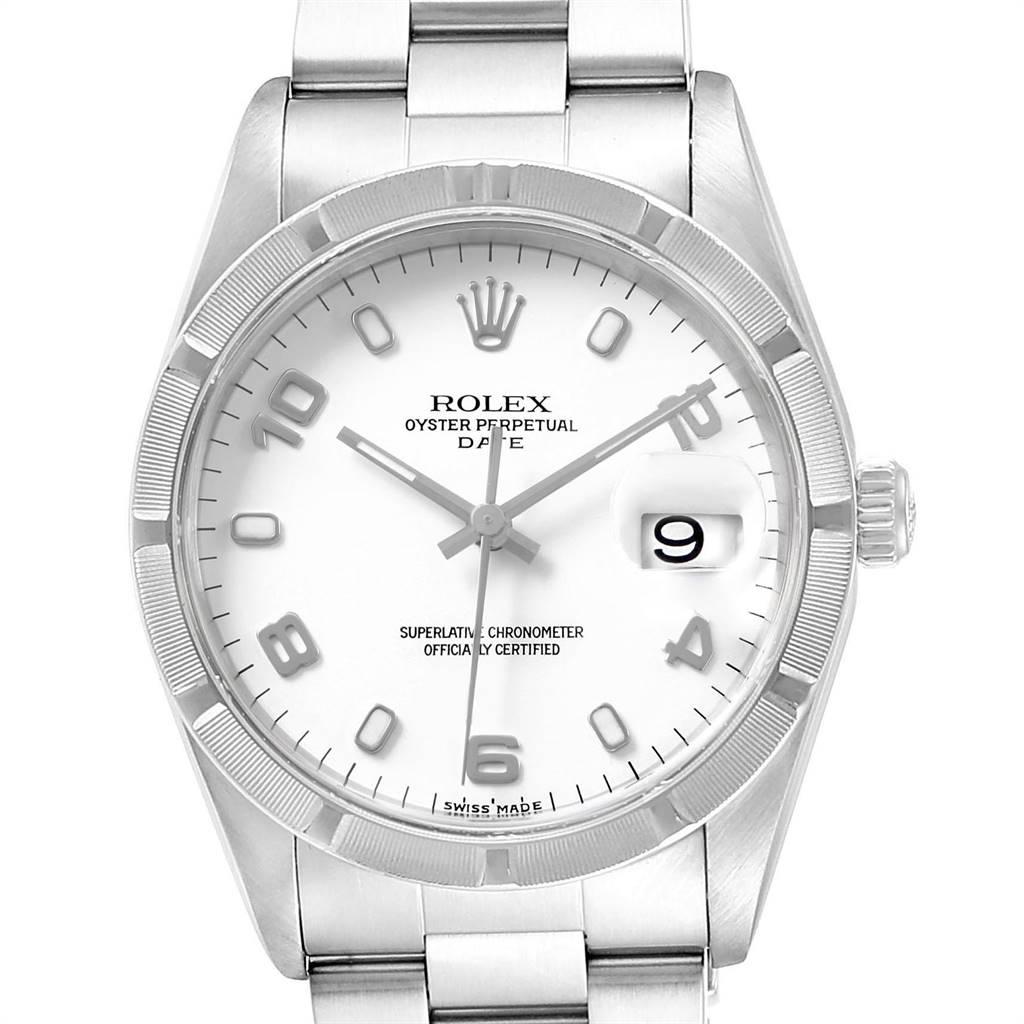 Rolex Date White Dial Engine Turned Bezel Steel Mens Watch 15210. Officially certified chronometer self-winding movement. Stainless steel oyster case 34.0 mm in diameter. Rolex logo on a crown. Stainless steel engine turned bezel. Scratch resistant
