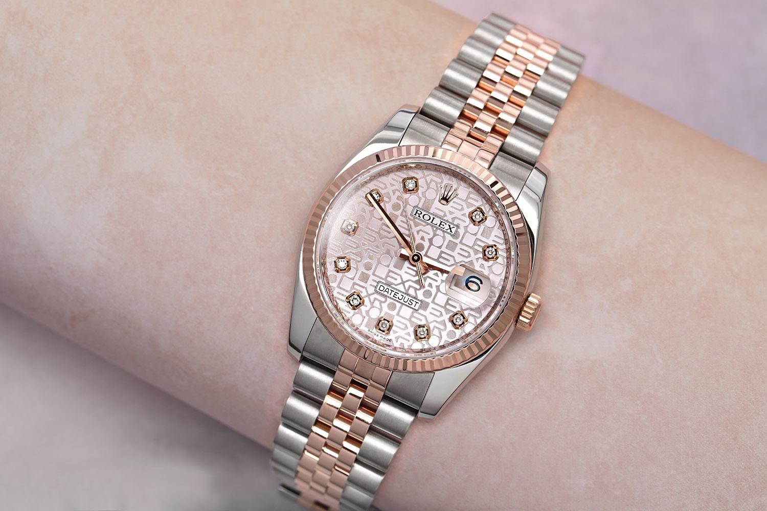 Rolex Datejust 116231 Mens Watch. 36mm stainless steel case. 18K rose gold fluted bezel. Pink anniversary diamond dial with rose gold hands and factory diamond hour markers. 18K rose gold & stainless steel Jubilee bracelet with a hidden fold-over