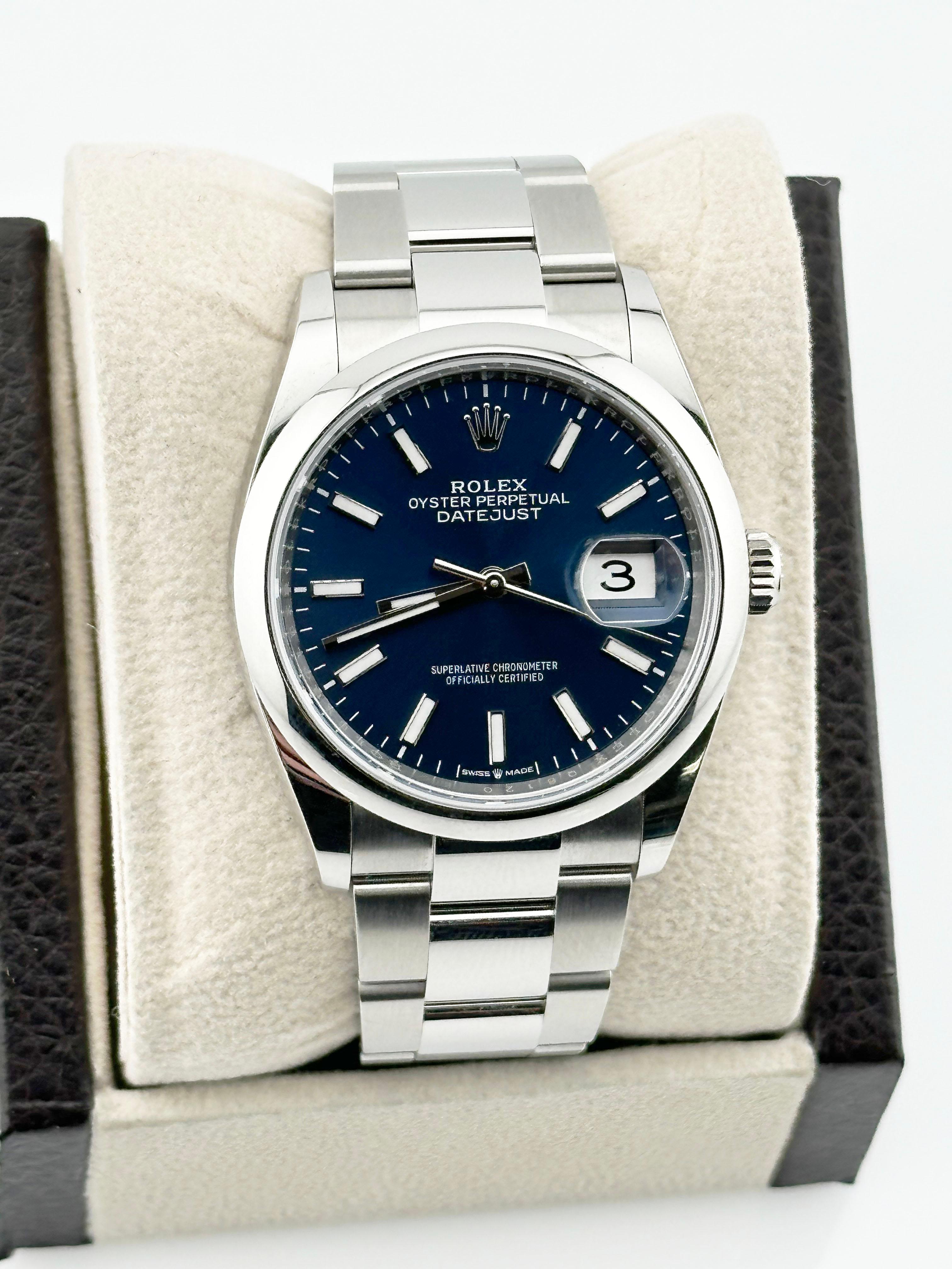 Style Number: 126200



Serial: Q8120***



Year: 2024

 

Model: Rolex Datejust 

 

Case Material: Stainless Steel 

 

Band:  Stainless Steel 

 

Bezel:  Stainless Steel Smooth 

 

Dial: Blue 

 

Face: Sapphire Crystal 

 

Case Size: 36mm 

