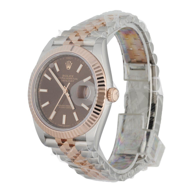Unworn Rolex Datejust 126331 men's watch. 41MM stainless steel case with 18K rose gold fluted bezel.Â Chocolate dial with luminous rose hands and luminous index hour marker. Engraved rehaut. Date display at 3 o'clock position. Stainless steel and