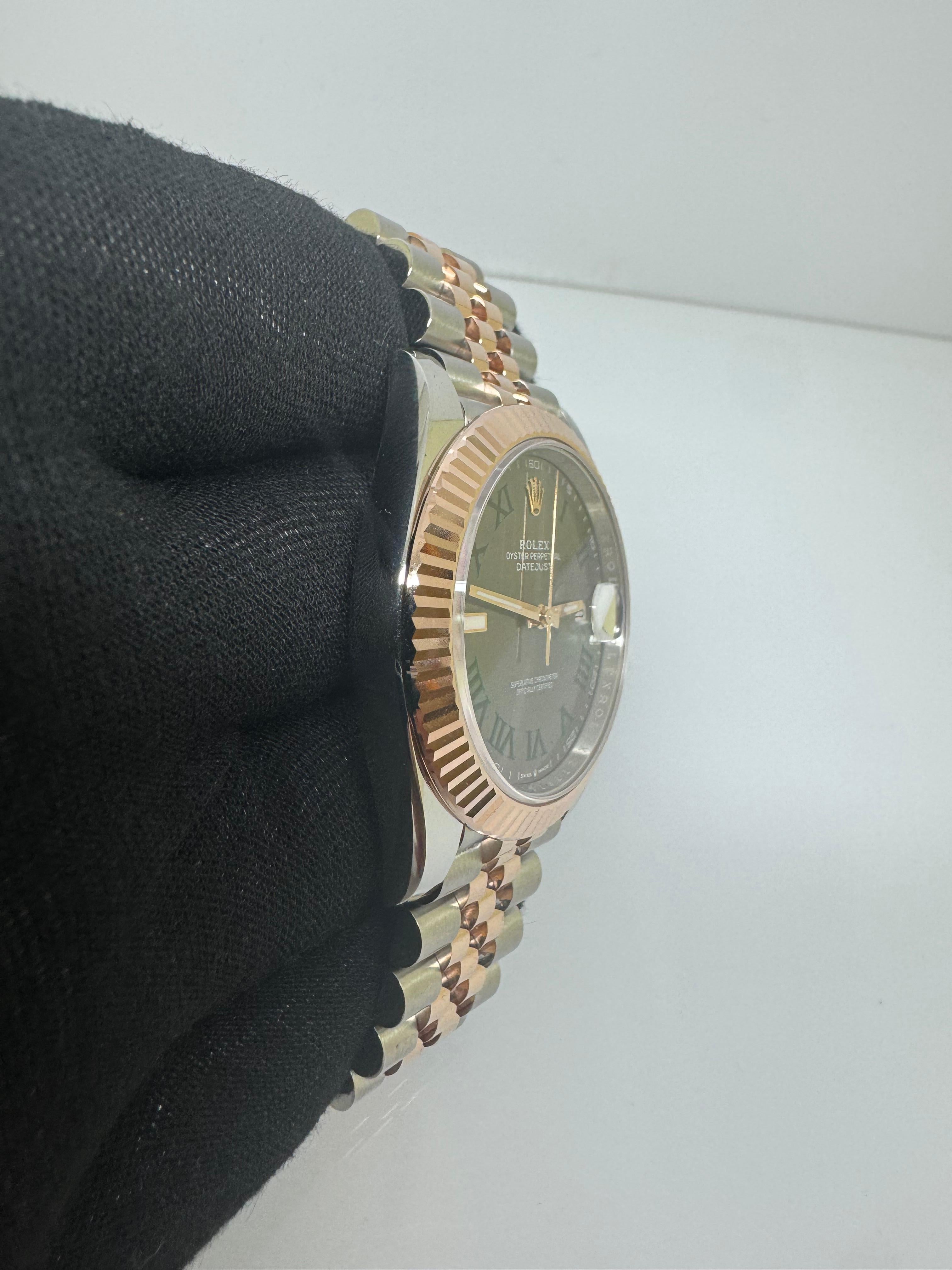 Rolex Datejust 41 – Two Tone Wimbledon Dial – 126331 – Jubilee Bracelet – 2025 – New

Experience timeless elegance with the Rolex Datejust 41 Ref. 126331, featuring the coveted Wimbledon dial – a striking slate grey face accented with green Roman