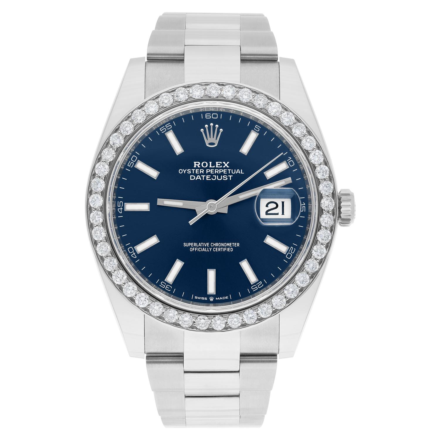 This magnificent Rolex Datejust wristwatch is a true masterpiece of Swiss craftsmanship. With its exquisite Blue Dial and elegant Index indicators, it is the epitome of luxury and style. The 41mm stainless steel case and custom diamond bezel make