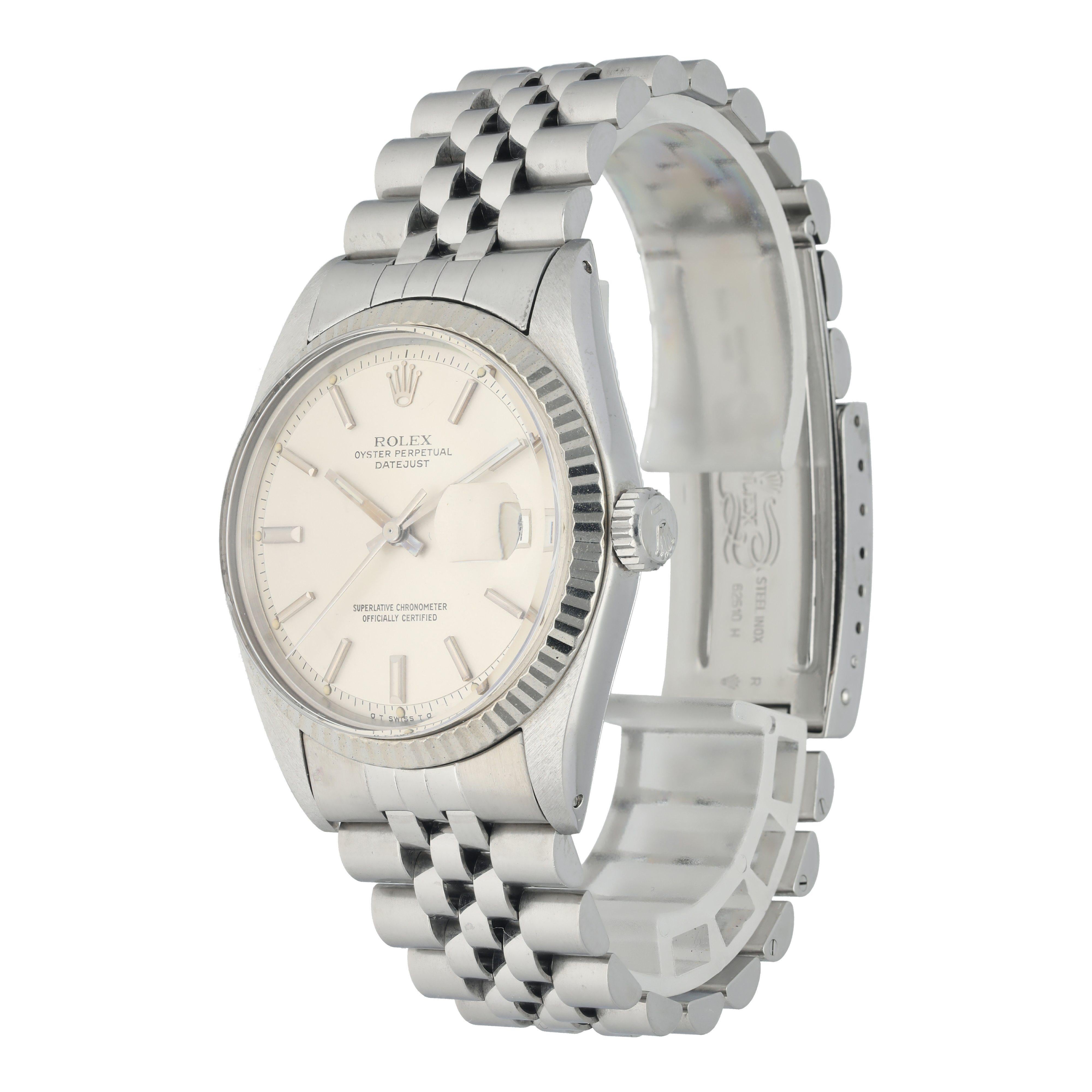 Rolex Oyster Perpetual Datejust 1601 Men's Watch. 
36mm stainless steel case with a white gold fluted bezel. 
Silver dial with steel hands and index hour markers. 
Minute markers around the outer dial.
Date display at the 3 o'clock position.