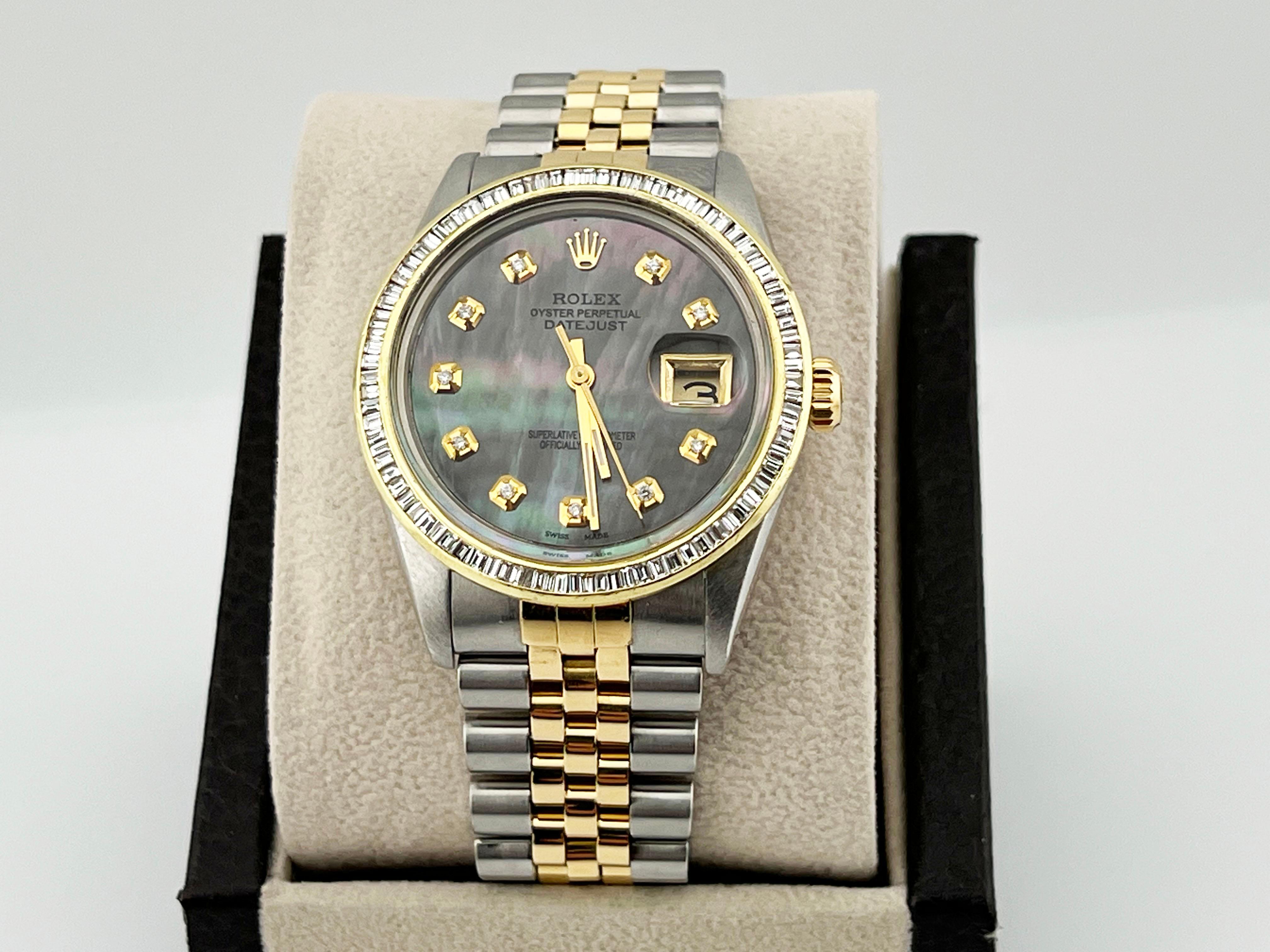 Style Number: 16013



Serial: 6225***

 

Model: Rolex Datejust 

 

Case Material: Stainless Steel 

 

Band: 18K Yellow Gold & Stainless Steel   

 

Bezel: Custom Diamond Bezel 

 

Dial: Custom Black Tahitian MOP Diamond Dial 

 

Face: