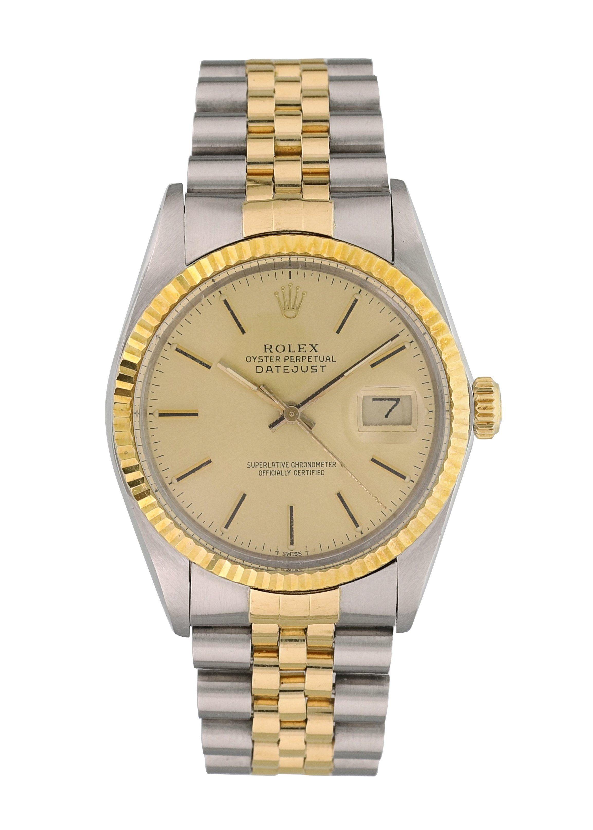 Rolex Datejust 16013 Mens Watch.
36mm Stainless Steel case. 
Yellow Gold Stationary bezel. 
Champagne dial with luminous gold hands and index hour markers. 
Minute markers on the outer dial. 
Date display at the 3 o'clock position. 
Stainless Steel