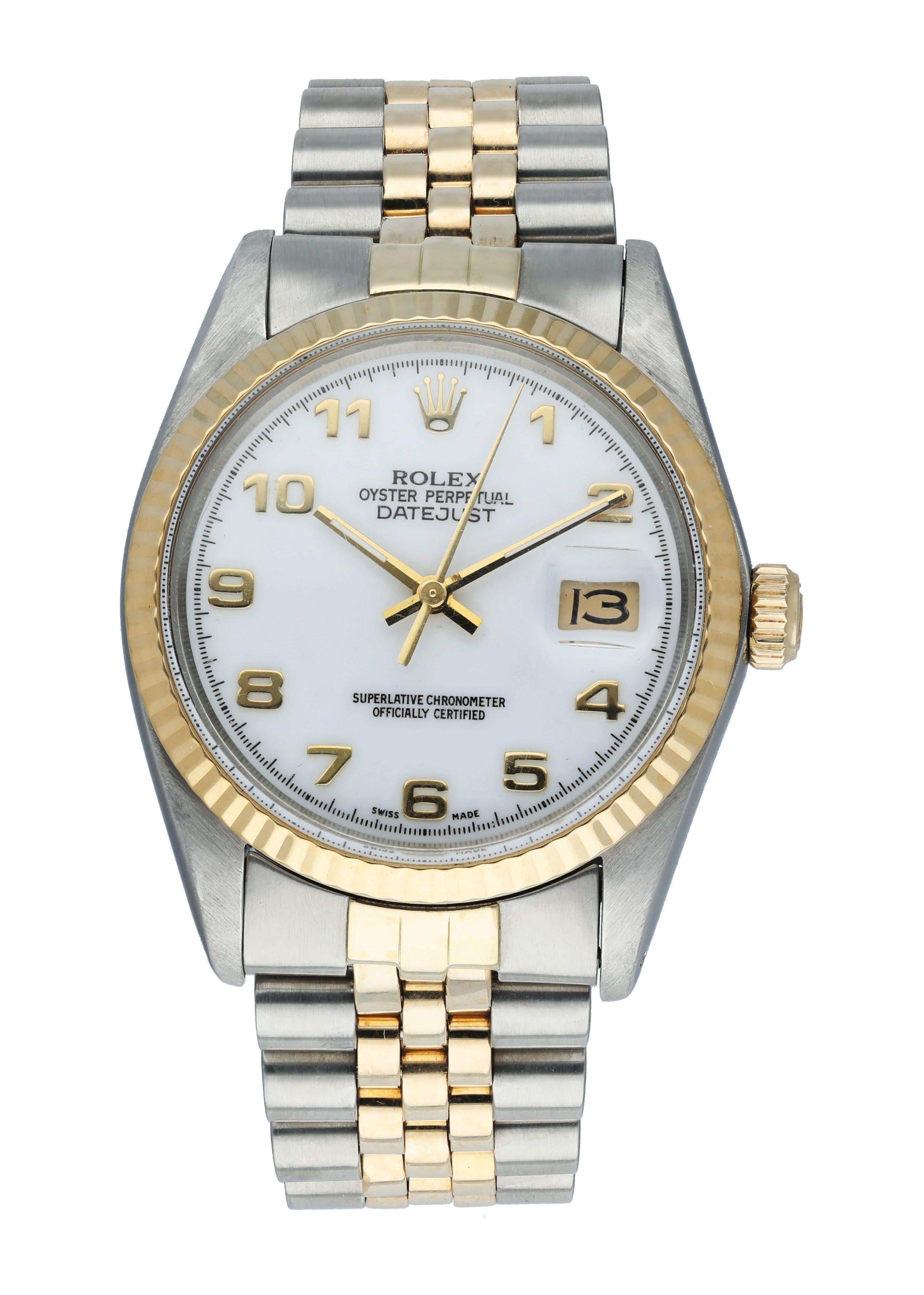 Rolex Datejust 16013 Men's Watch. 
36mm Stainless Steel case. 
Yellow Gold fluted bezel. 
White dial with gold hands and Arabic numeral hour markers. 
Minute markers on the outer dial. 
Date display at the 3 o'clock position. 
Two Tone Stainless