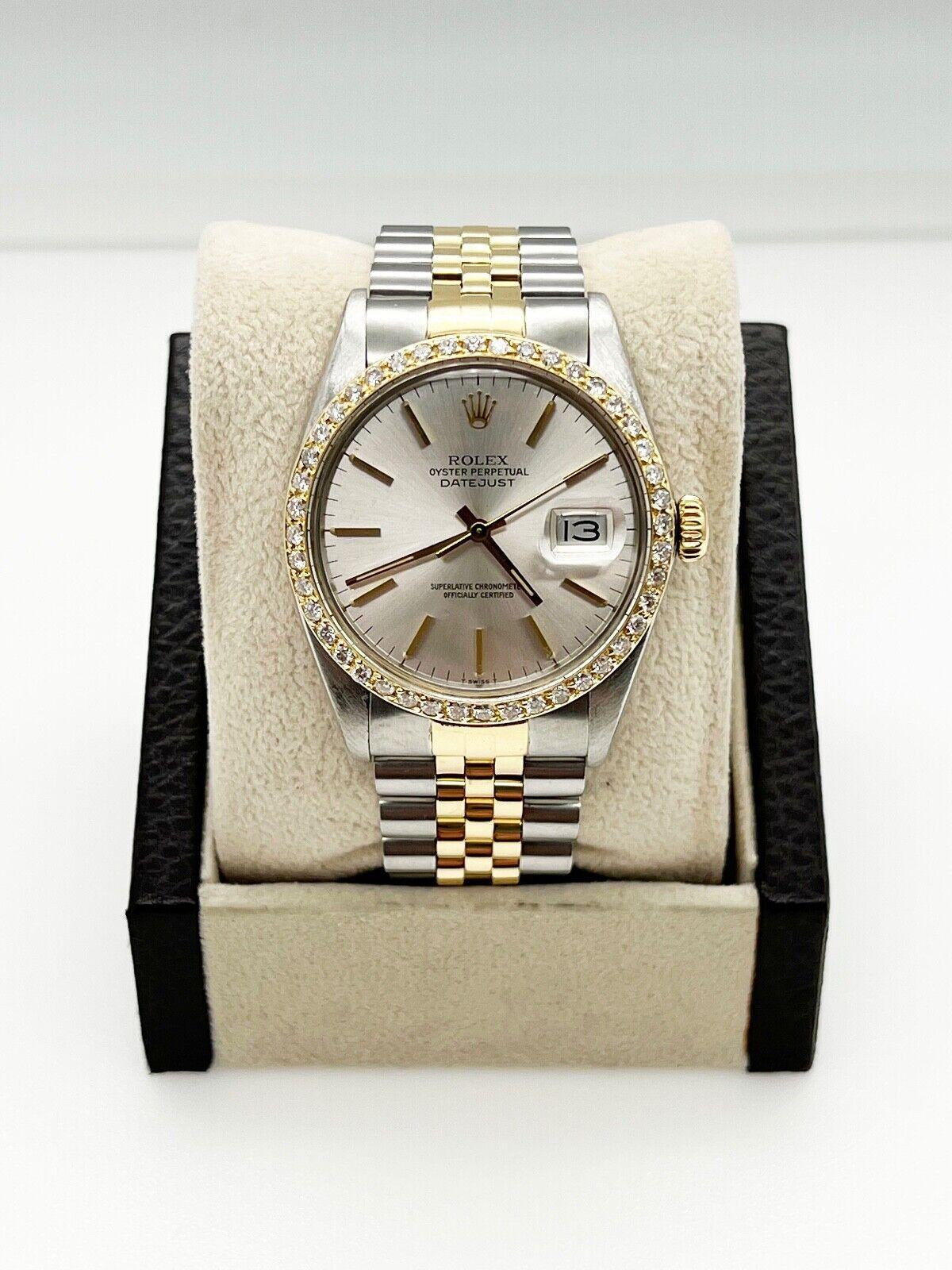 Style Number: 16013

Serial: 8361***

Year: 1986

Model: Datejust 

Case Material: Stainless Steel 

Band: 18K Yellow Gold & Stainless Steel 

Bezel: Custom Diamond Bezel 

Dial: Silver Dial 

Face: Acrylic 

Case Size: 36mm 

 Includes: 

-Elegant