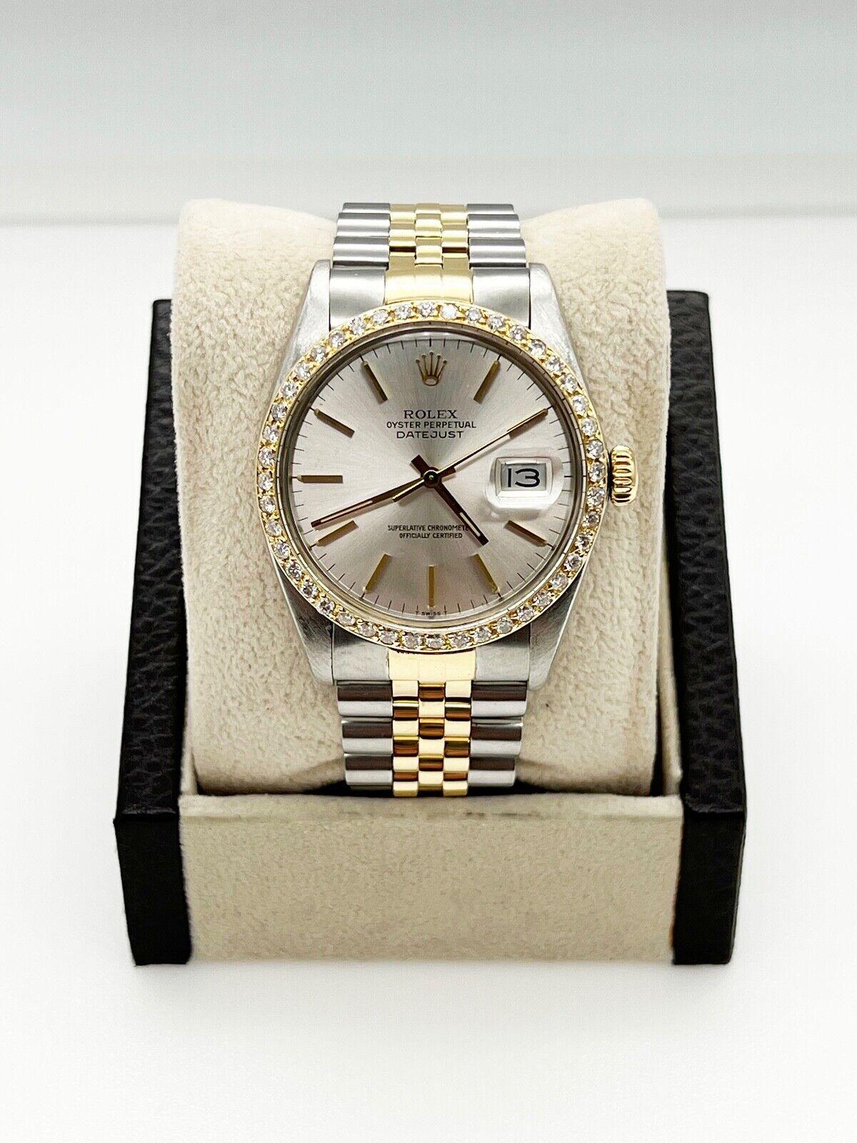 Stil Nummer: 16013

Seriennummer: 8361***

Jahr: 1986

Modell: Datejust 

MATERIAL des Gehäuses: Rostfreier Stahl 

Band: 18K Gelbgold & Edelstahl 

Lünette: Kundenspezifische Diamantlünette 

Zifferblatt: Silbernes Zifferblatt 

Gesicht: Acryl