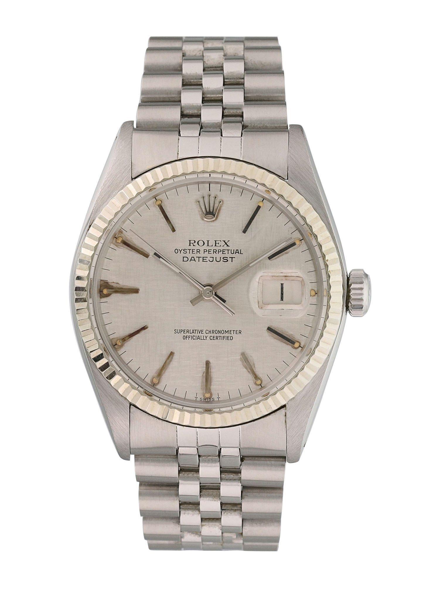 Rolex Datejust 16014 Men's Watch.
36mm Stainless Steel case. 
White Gold fluted bezel. 
Grey Linen dial with steel hands and index hour markers. Some aging around the indexes.
Minute markers on the outer dial. 
Date display at the 3 o'clock