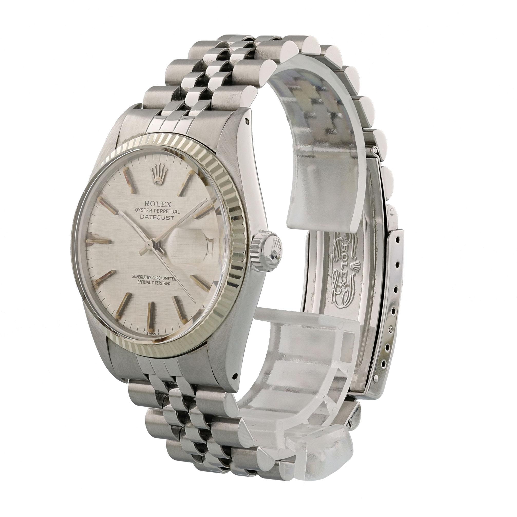 Rolex Datejust 16014 Men's Watch.
36mm Stainless Steel case. 
White Gold fluted bezel. 
Grey Linen dial with steel hands and index hour markers. Some aging around the indexes.
Minute markers on the outer dial. 
Date display at the 3 o'clock