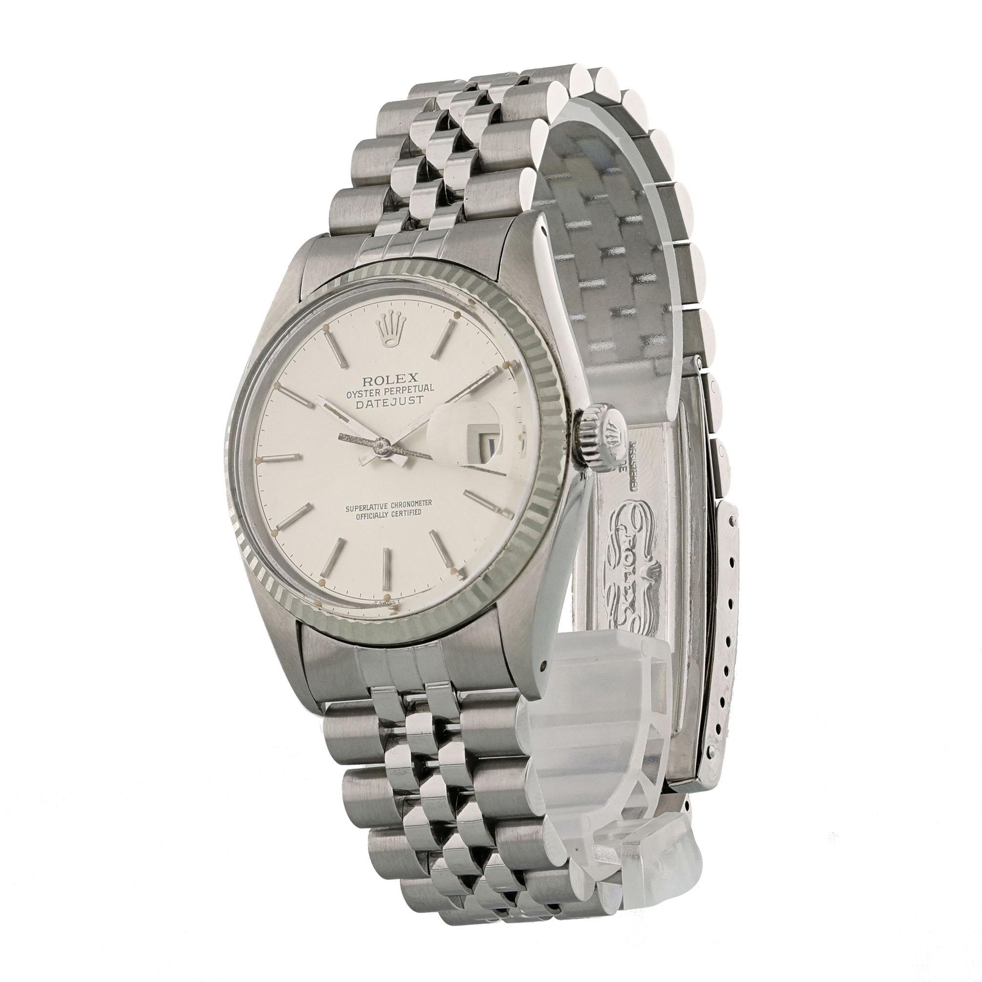 Rolex Datejust 16014 Dial Men's Watch.
36mm Stainless Steel case. 
White Gold fluted bezel. 
Silver dial with steel hands and index hour markers. 
Minute markers on the outer dial. 
Date display at the 3 o'clock position. 
Stainless Steel Bracelet